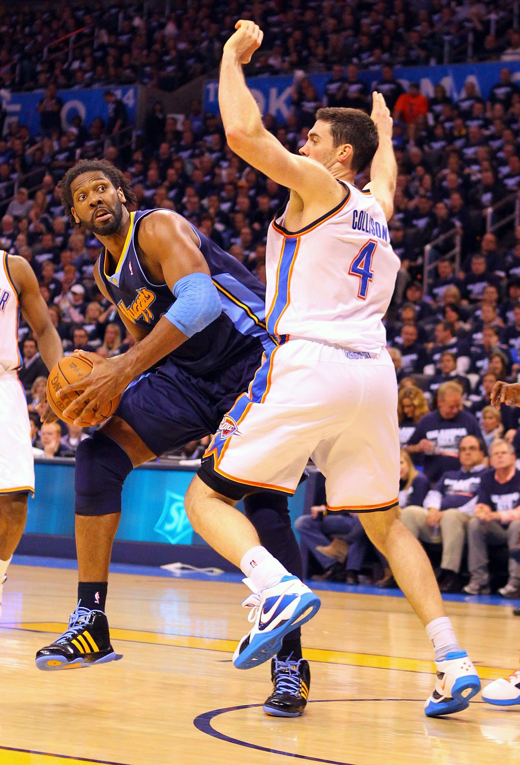 OKLAHOMA CITY, OK - APRIL 27: Nene Hilario #31 of the Denver Nuggets looks to shoot the ball against Nick Collison #4 of the Oklahoma City Thunder in Game Five of the Western Conference Quarterfinals in the 2011 NBA Playoffs on April 27, 2011 at the Ford