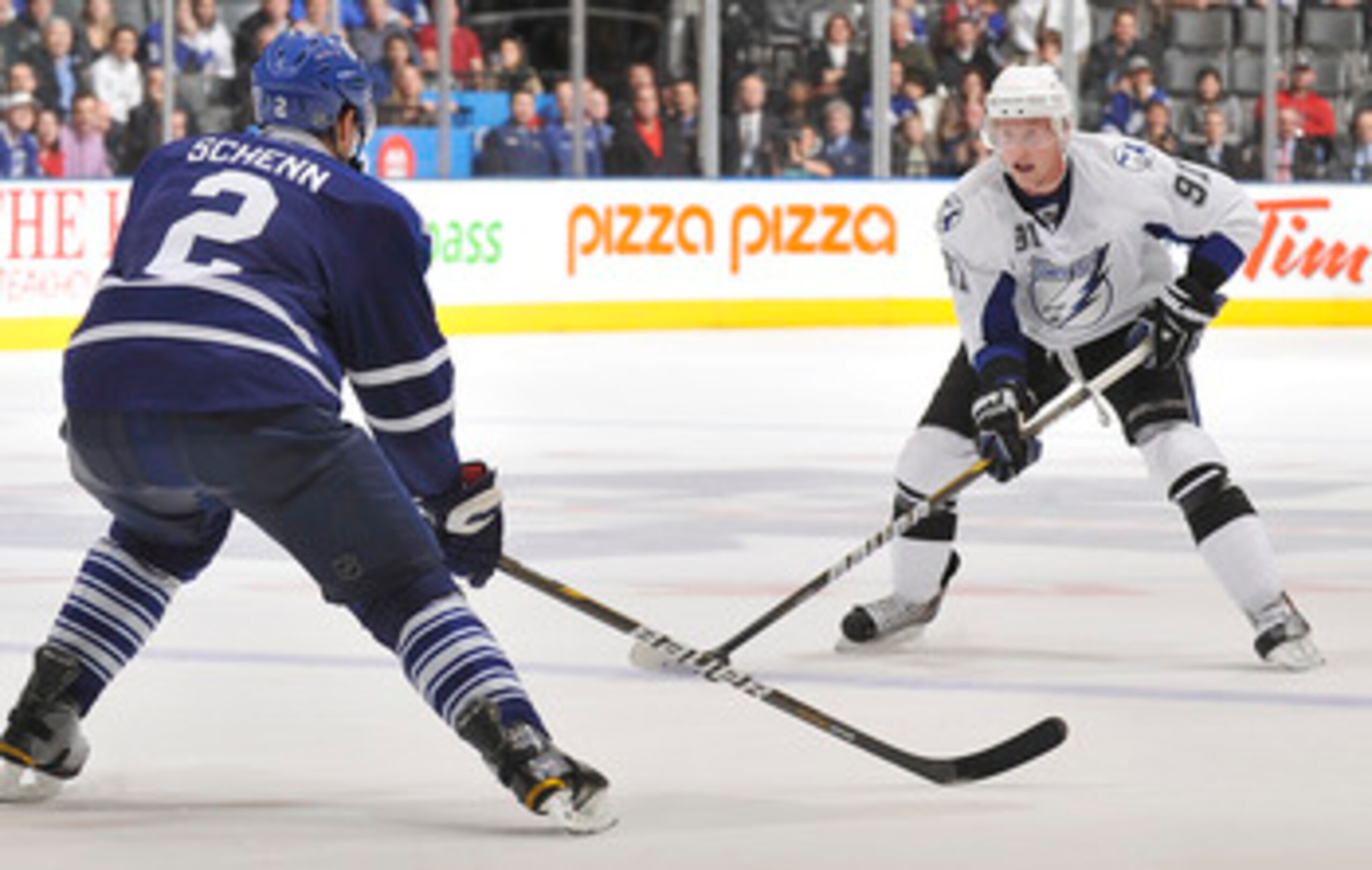 TORONTO, CANADA - NOVEMBER 30:  Luke Schenn #2 of the Toronto Maple Leafs defends against Steven Stamkos #91of the Tampa Bay Lightning during game action November 30, 2010 at the Air Canada Centre in Toronto, Ontario, Canada. (Photo by Abelimages/Getty Im