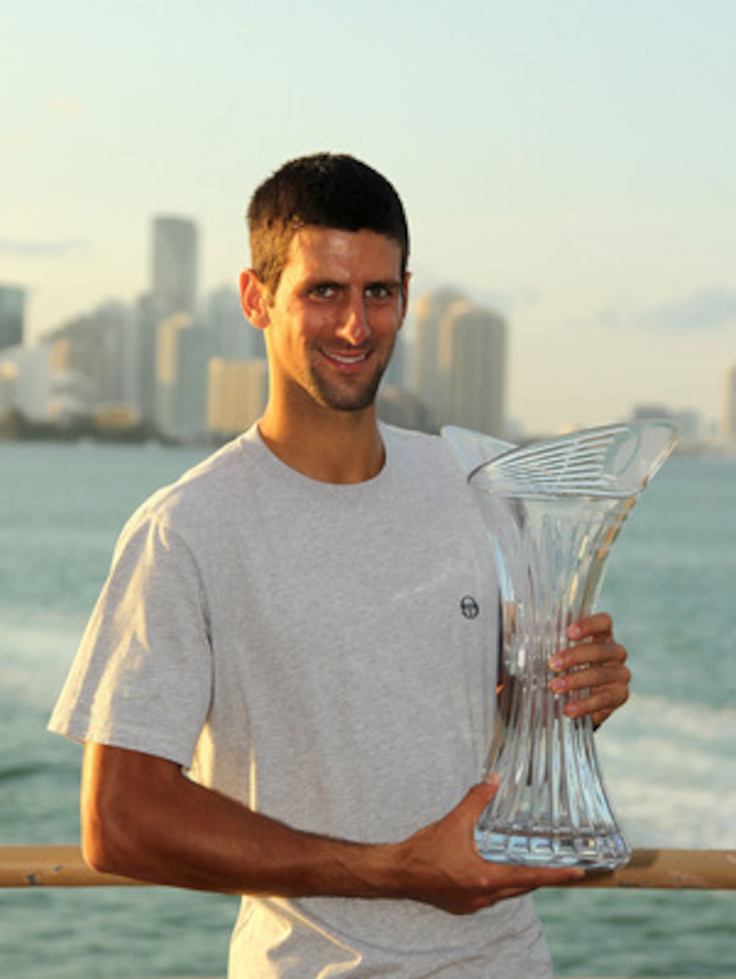 KEY BISCAYNE, FL - APRIL 03:  Novak Djokovic of Serbia poses with the trophy at the Rusty Pelican Restraunt after winning the men's singles title from the Sony Ericsson Open at Crandon Park Tennis Center on April 3, 2011 in Key Biscayne, Florida.  (Photo