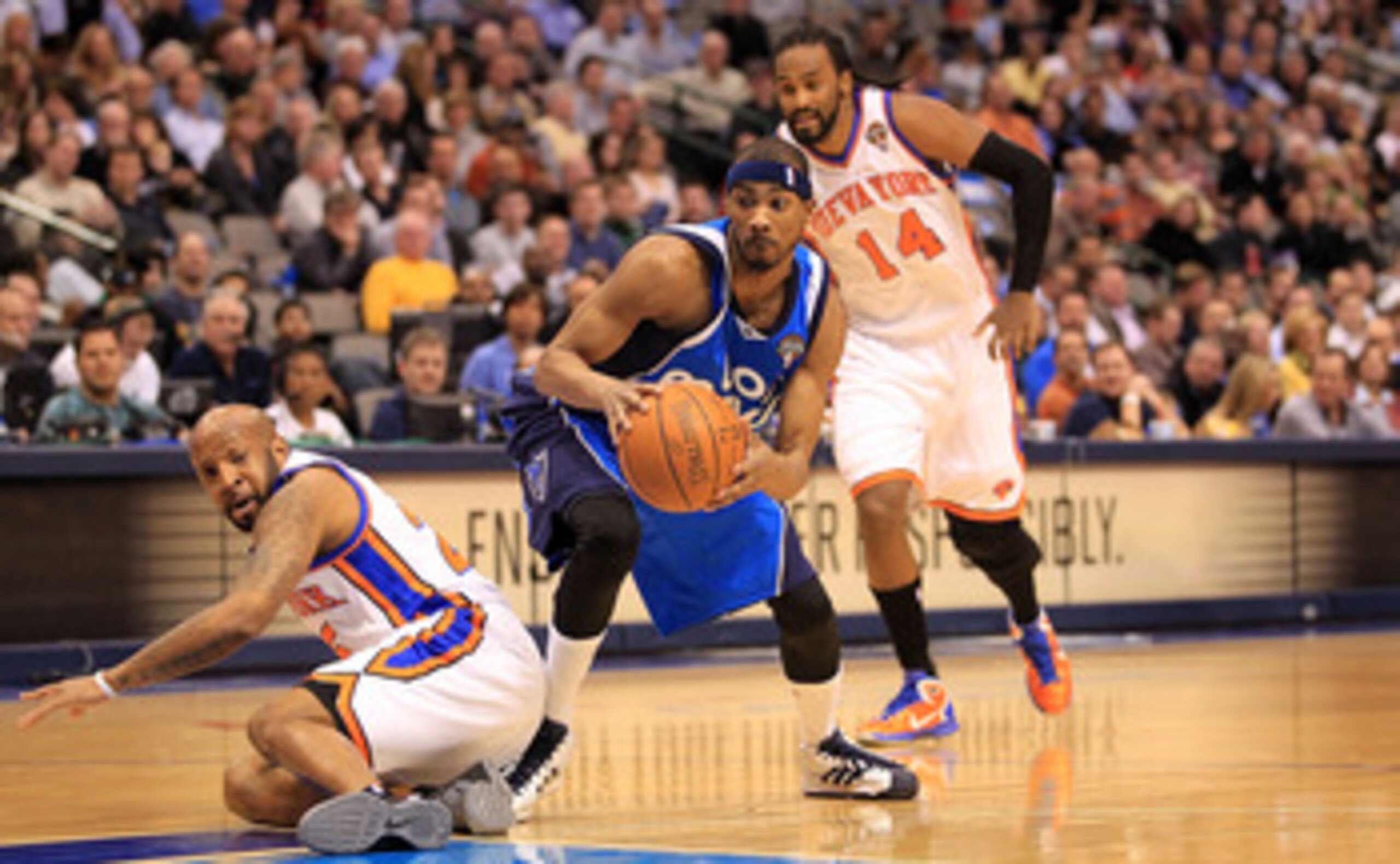 DALLAS, TX - MARCH 10:  Forward Corey Brewer #13 of the Dallas Mavericks steals the ball from Anthony Carter #25 of the New York Knicks at American Airlines Center on March 10, 2011 in Dallas, Texas.  NOTE TO USER: User expressly acknowledges and agrees t