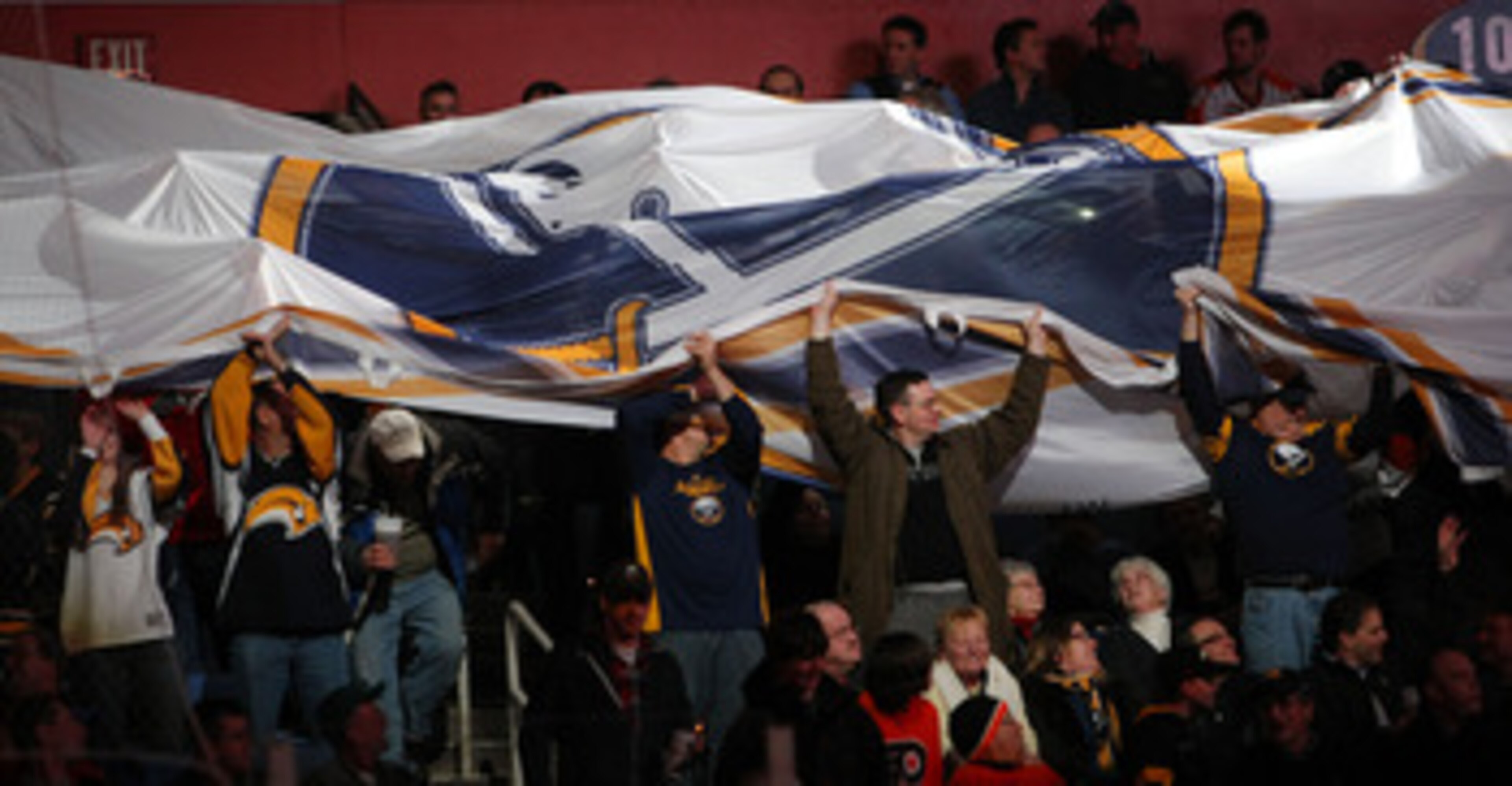 BUFFALO NY - JANUARY 11:  Prior to the start of the Buffalo Sabres match against the Philadelphia Flyers fans pass around a giant Sabres flag during their NHL game at HSBC Arena January 11, 2011 in Buffalo, New York. (Photo By Dave Sandford/Getty Images)