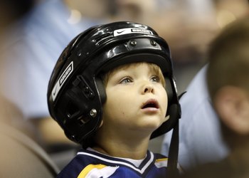 KANSAS CITY, MO - SEPTEMBER 22:  A young fan looks on during the preseason game between the St. Louis Blues and the Los Angeles Kings on September 22, 2008 at the Sprint Center in Kansas City, Missouri. The Kings defeated the Blues 2-1. (Photo by Jamie Sq