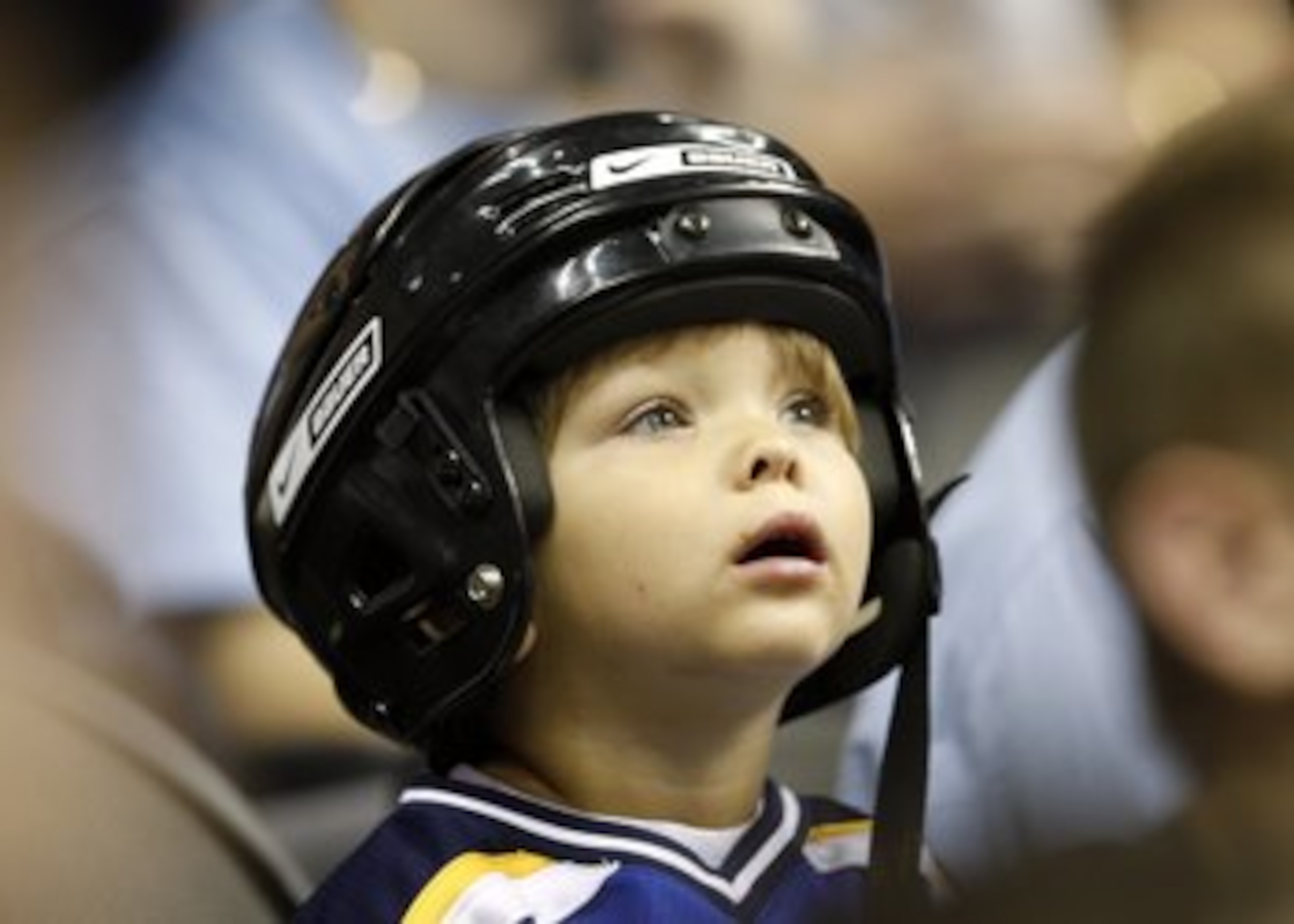KANSAS CITY, MO - SEPTEMBER 22: A young fan looks on during the preseason game between the St. Louis Blues and the Los Angeles Kings on September 22, 2008 at the Sprint Center in Kansas City, Missouri. The Kings defeated the Blues 2-1. (Photo by Jamie Sq KANSAS CITY, MO - SEPTEMBER 22: A young fan looks on during the preseason game between the St. Louis Blues and the Los Angeles Kings on September 22, 2008 at the Sprint Center in Kansas City, Missouri. The Kings defeated the Blues 2-1. (Photo by Jamie Sq