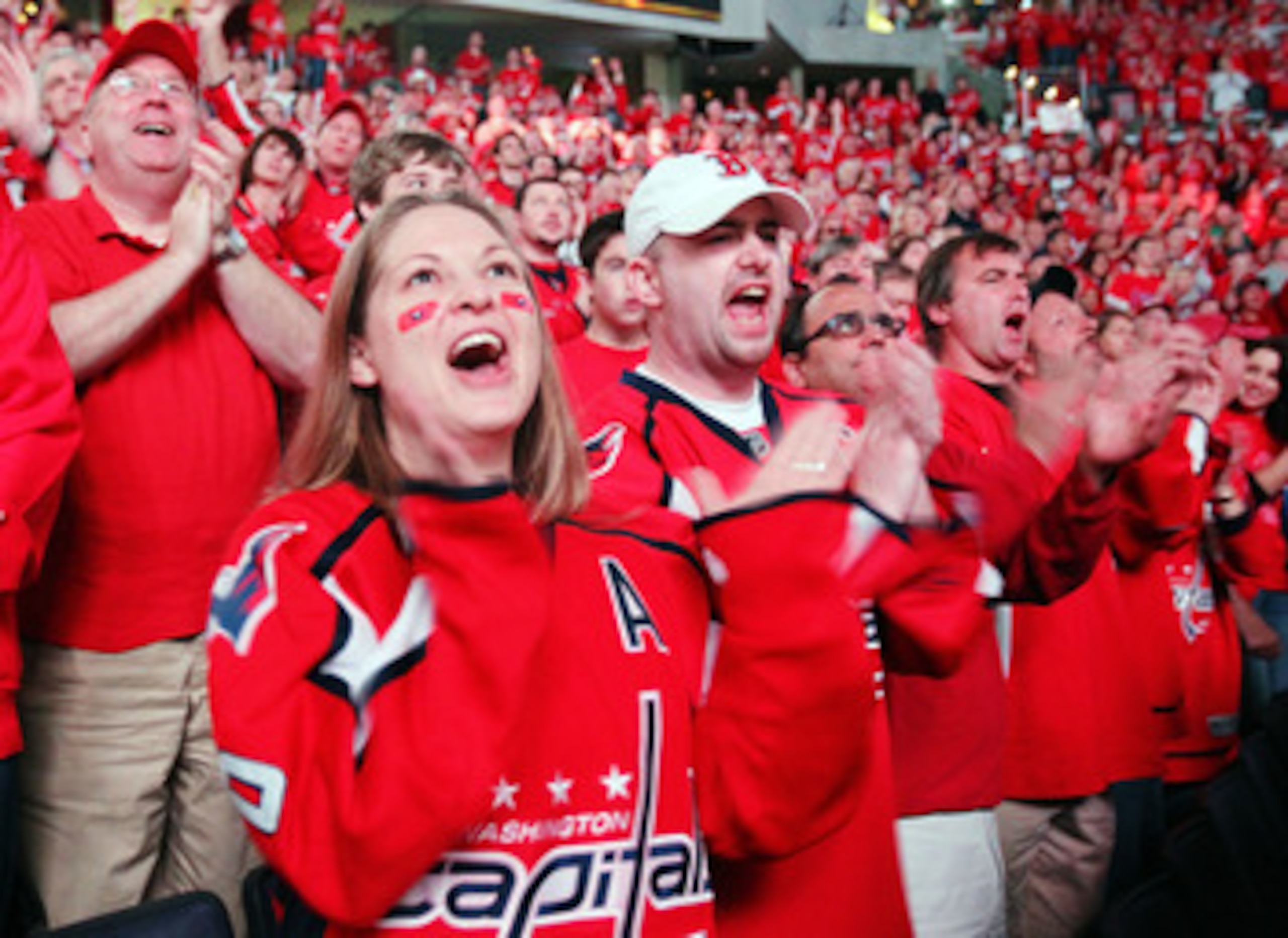 WASHINGTON , DC - APRIL 23: Fans of the Washington Capitals cheer their team on following a 3-1 win over the New York Rangers in Game Five of the Eastern Conference Quarterfinals during the 2011 NHL Stanley Cup Playoffs at the Verizon Center on April 23, WASHINGTON , DC - APRIL 23: Fans of the Washington Capitals cheer their team on following a 3-1 win over the New York Rangers in Game Five of the Eastern Conference Quarterfinals during the 2011 NHL Stanley Cup Playoffs at the Verizon Center on April 23,