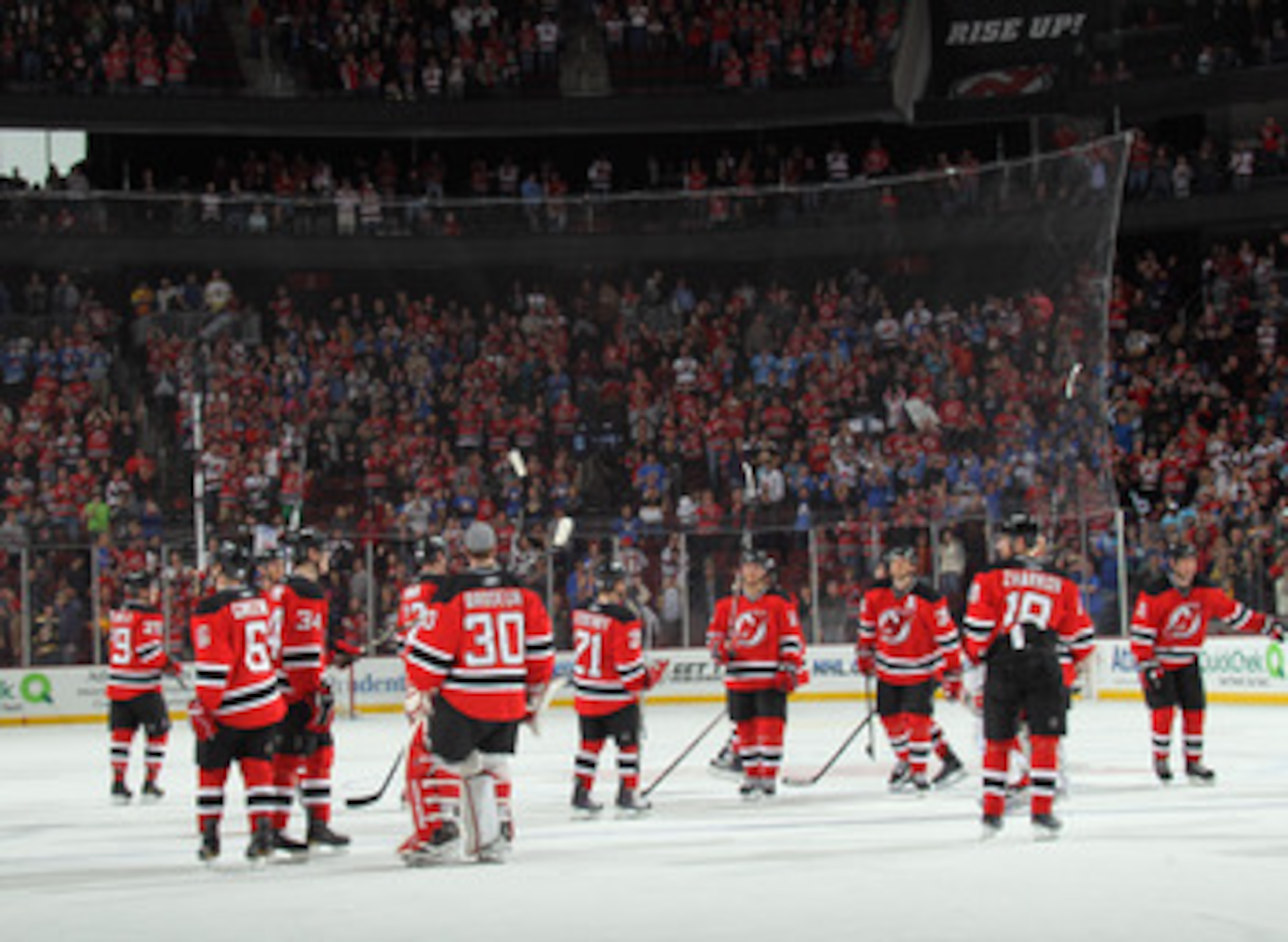 NEWARK, NJ - APRIL 10: The New Jersey Devils salute their fans following their last game of the season against the Boston Bruins at the Prudential Center on April 10, 2011 in Newark, New Jersey.  (Photo by Bruce Bennett/Getty Images)