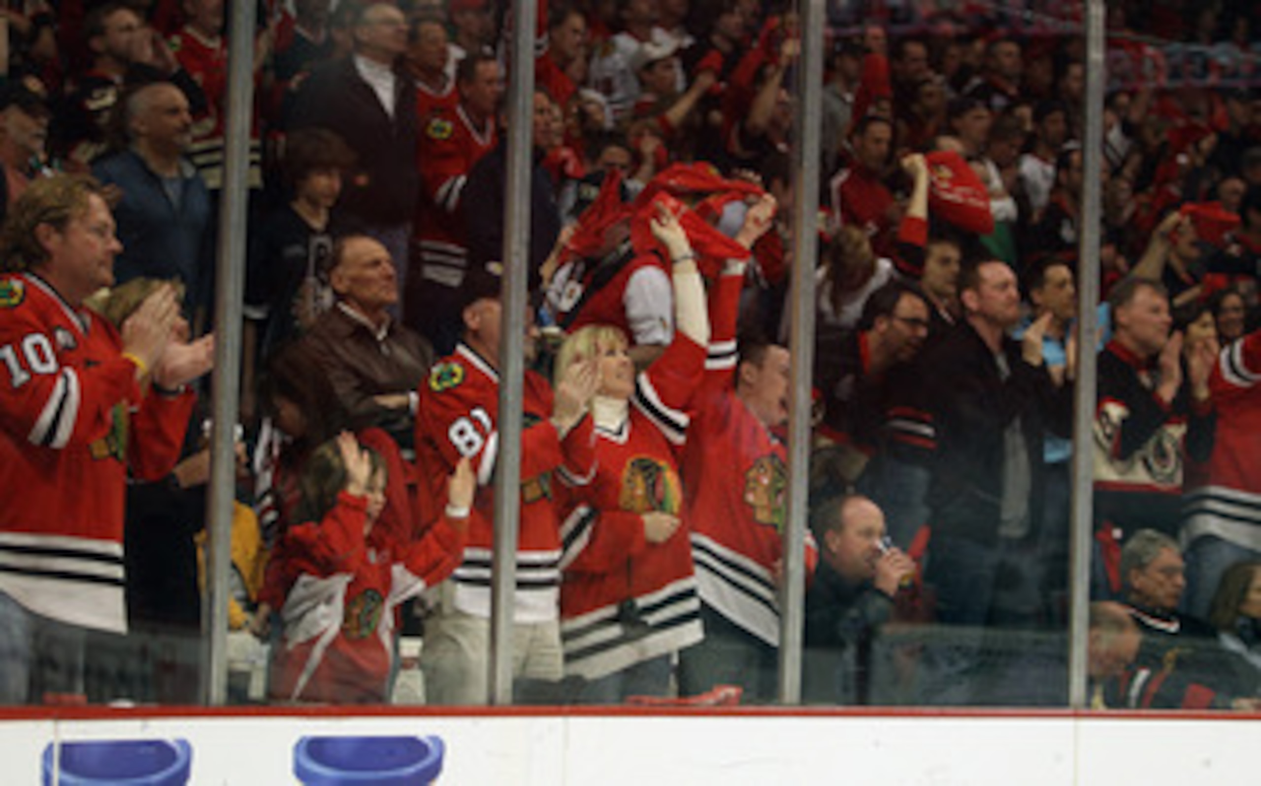 CHICAGO, IL - APRIL 24: Fans of the Chicago Blackhawks cheer a goal against of the Vancouver Canucks in Game Six of the Western Conference Quarterfinals during the 2011 NHL Stanley Cup Playoffs at the United Center on April 24, 2011 in Chicago, Illinois. CHICAGO, IL - APRIL 24: Fans of the Chicago Blackhawks cheer a goal against of the Vancouver Canucks in Game Six of the Western Conference Quarterfinals during the 2011 NHL Stanley Cup Playoffs at the United Center on April 24, 2011 in Chicago, Illinois.