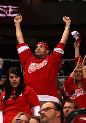 GLENDALE, AZ - APRIL 20:  Fans of the Detroit Red Wings celebrate in the final moments of Game Four of the Western Conference Quarterfinals against the Phoenix Coyotes during the 2011 NHL Stanley Cup Playoffs at Jobing.com Arena on April 20, 2011 in Glend
