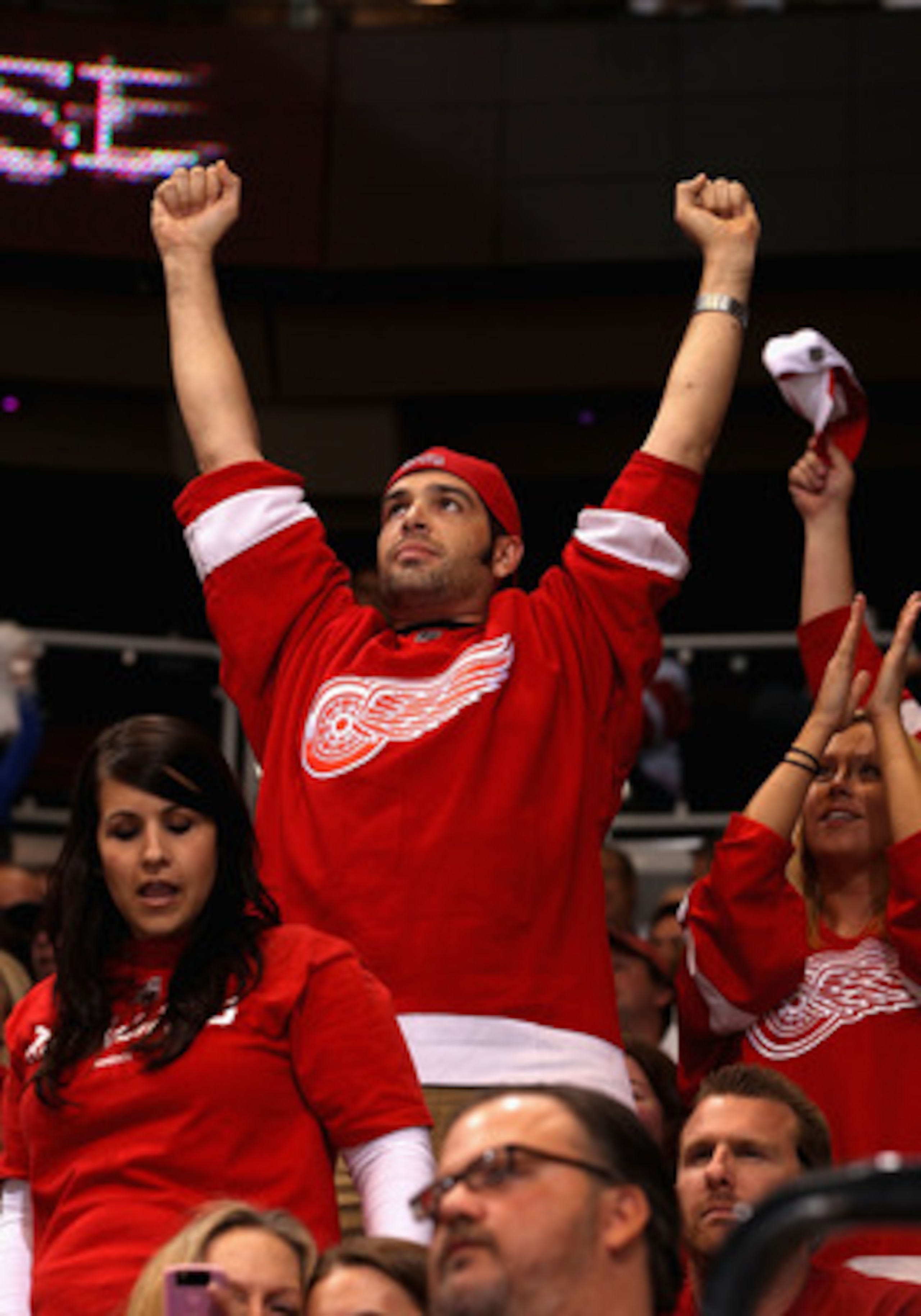 GLENDALE, AZ - APRIL 20: Fans of the Detroit Red Wings celebrate in the final moments of Game Four of the Western Conference Quarterfinals against the Phoenix Coyotes during the 2011 NHL Stanley Cup Playoffs at Jobing.com Arena on April 20, 2011 in Glend GLENDALE, AZ - APRIL 20: Fans of the Detroit Red Wings celebrate in the final moments of Game Four of the Western Conference Quarterfinals against the Phoenix Coyotes during the 2011 NHL Stanley Cup Playoffs at Jobing.com Arena on April 20, 2011 in Glend