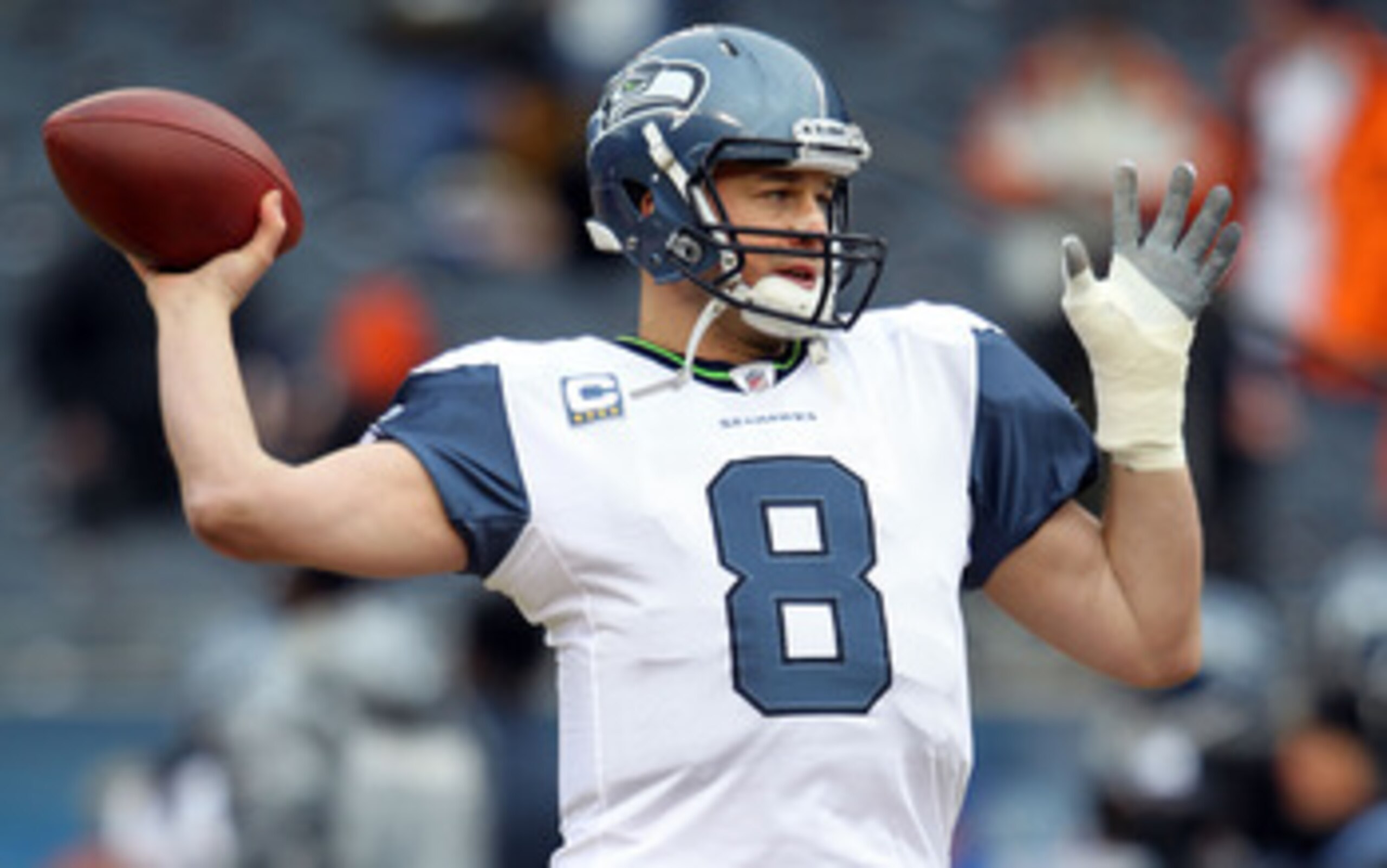 CHICAGO, IL - JANUARY 16:  Quarterback Matt Hasselbeck #8 of the Seattle Seahawks looks to throw the ball during pregame before taking on the Chicago Bears in the 2011 NFC divisional playoff game at Soldier Field on January 16, 2011 in Chicago, Illinois.