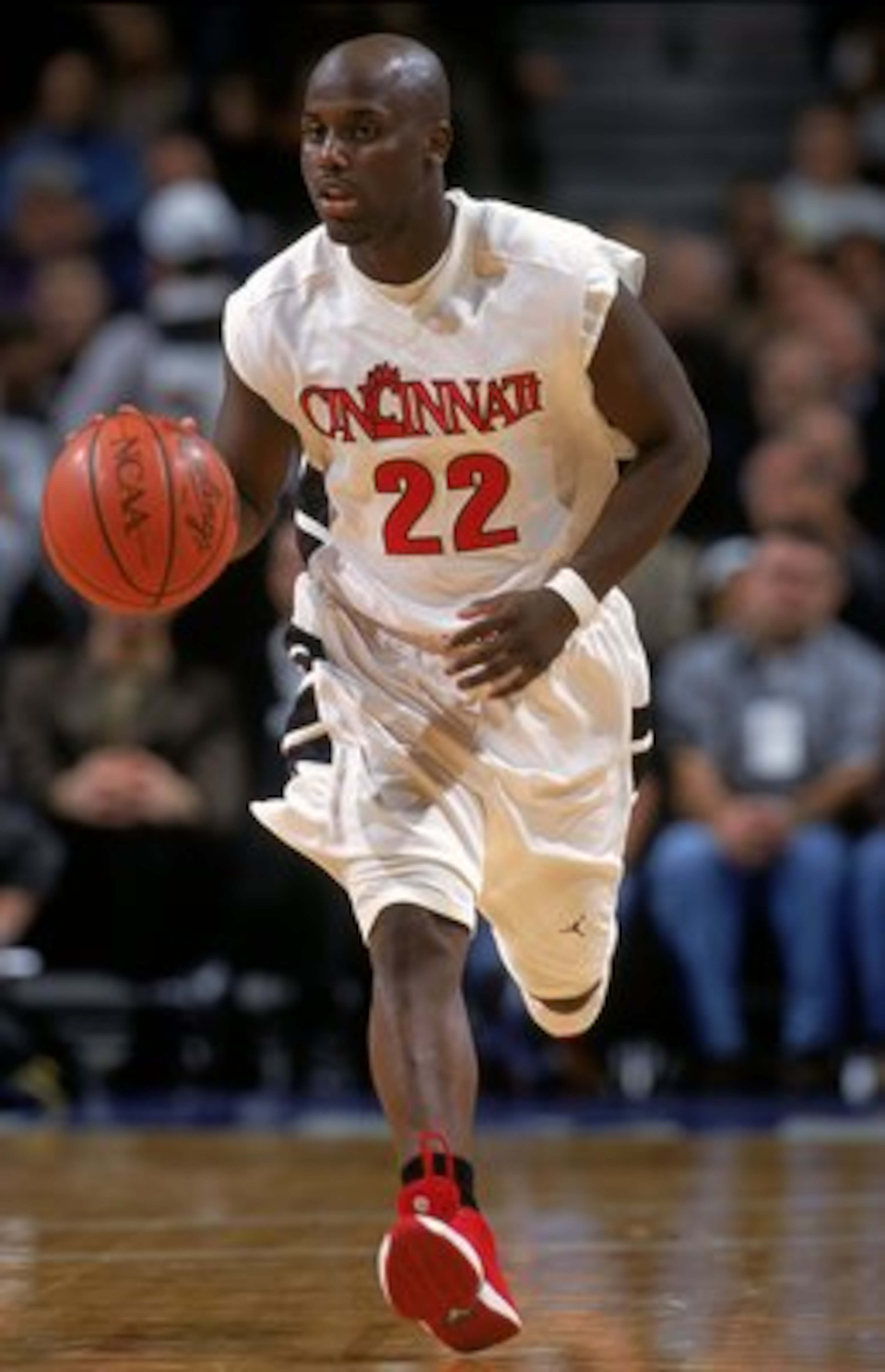 8 Dec 1999: Steve Logan #22 of the Cincinnati Bearcats dribbles the ball down court during the Great Eight game against the UNC Tar Heels at the United Center in Chicago, Illinois. The Bearcats defeated the Tar Heels 77-68. Mandatory Credit: Jonathan Dani
