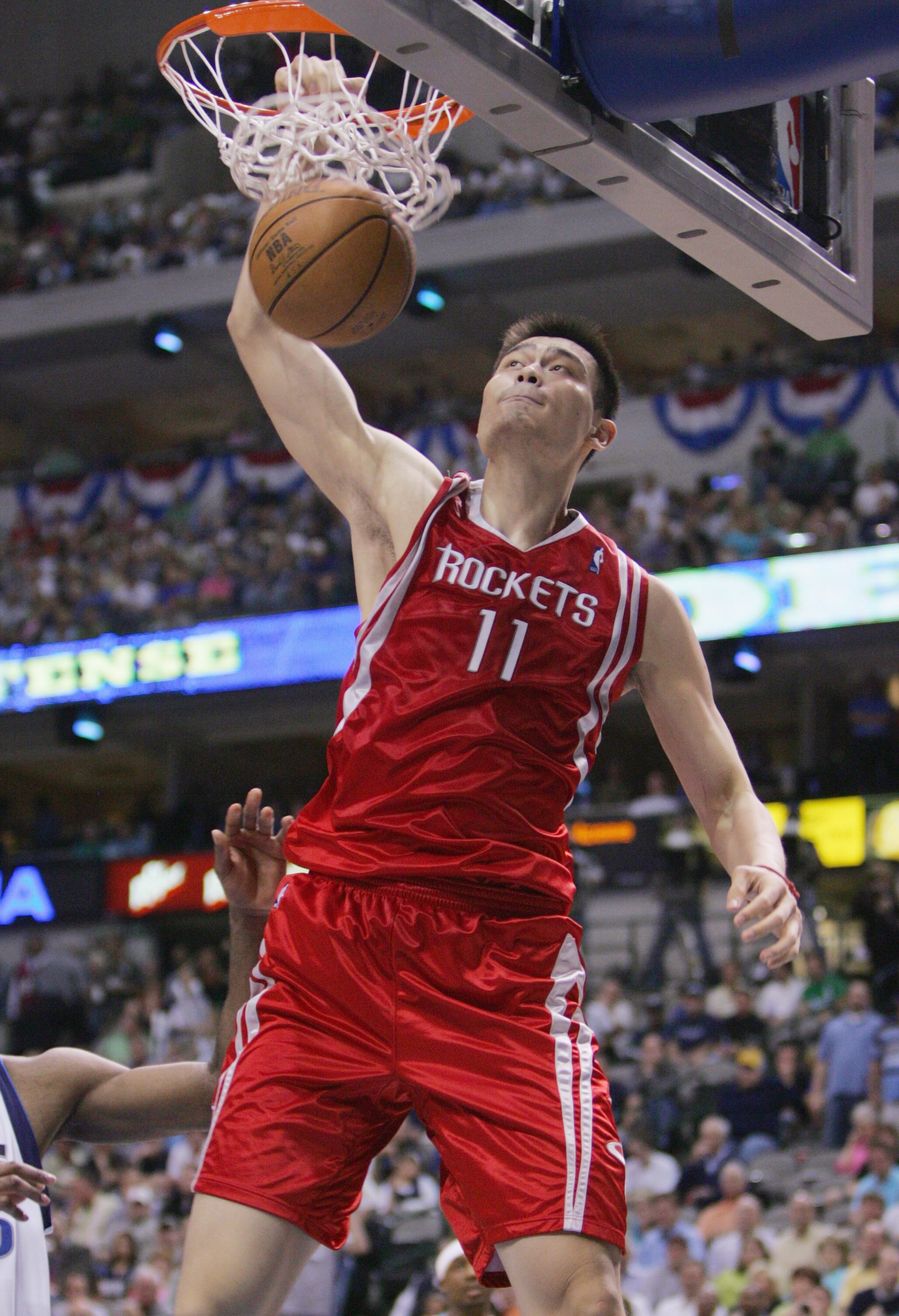 DALLAS - MAY 7:  Yao Ming #11 of the Houston Rockets dunks against the Dallas Mavericks in Game seven of the Western Conference Quarterfinals during the 2005 NBA Playoffs at the American Airlines Center on May 7, 2005 in Dallas, Texas. The Mavs won 116-76
