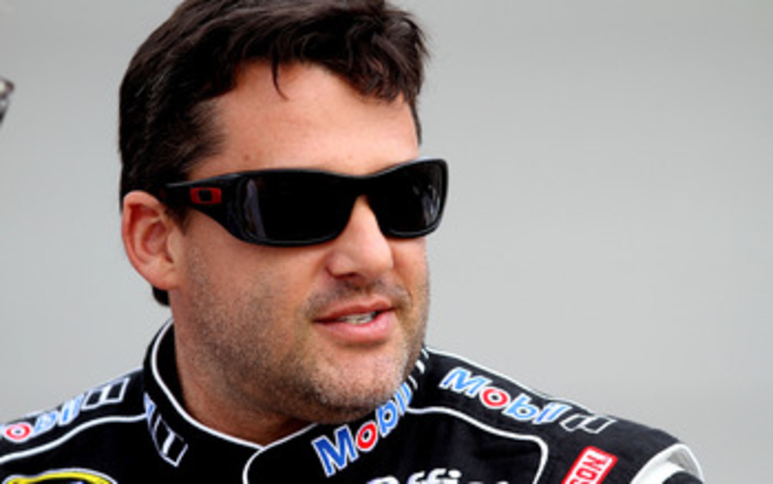 RICHMOND, VA - APRIL 29:  Tony Stewart, driver of the #14 Mobil 1/Office Depot Chevrolet, stands on pit road during qualifying for the NASCAR Sprint Cup Series Crown Royal Presents The Matthew & Daniel Hansen 400 at Richmond International Raceway on April