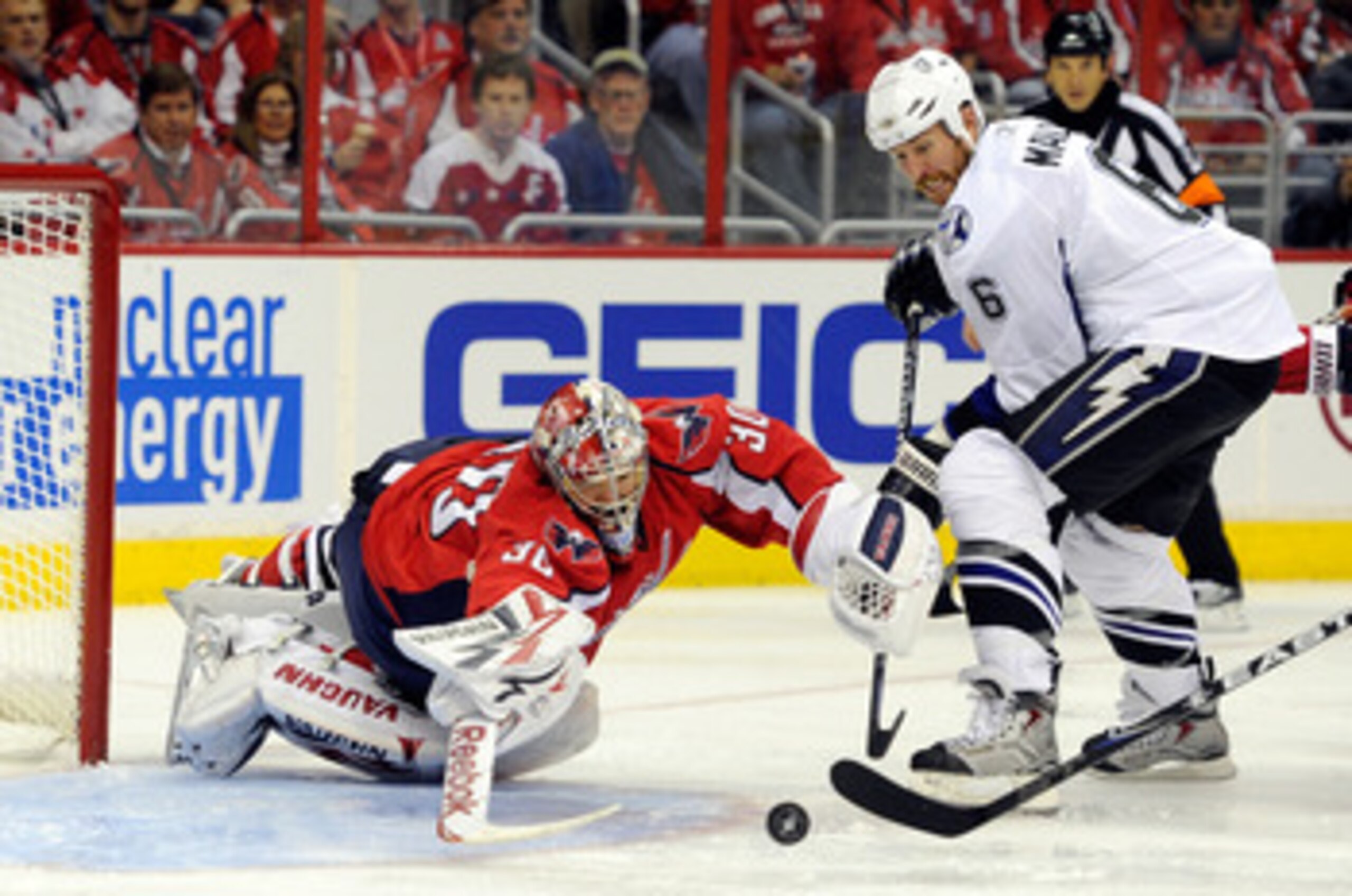 WASHINGTON, DC - MAY 01:  Michal Neuvirth #30 of the Washington Capitals makes a save against Ryan Malone #6 of the Tampa Bay Lightning during Game Two of the Eastern Conference Semifinal during the 2011 NHL Stanley Cup Playoffs at the Verizon Center on M
