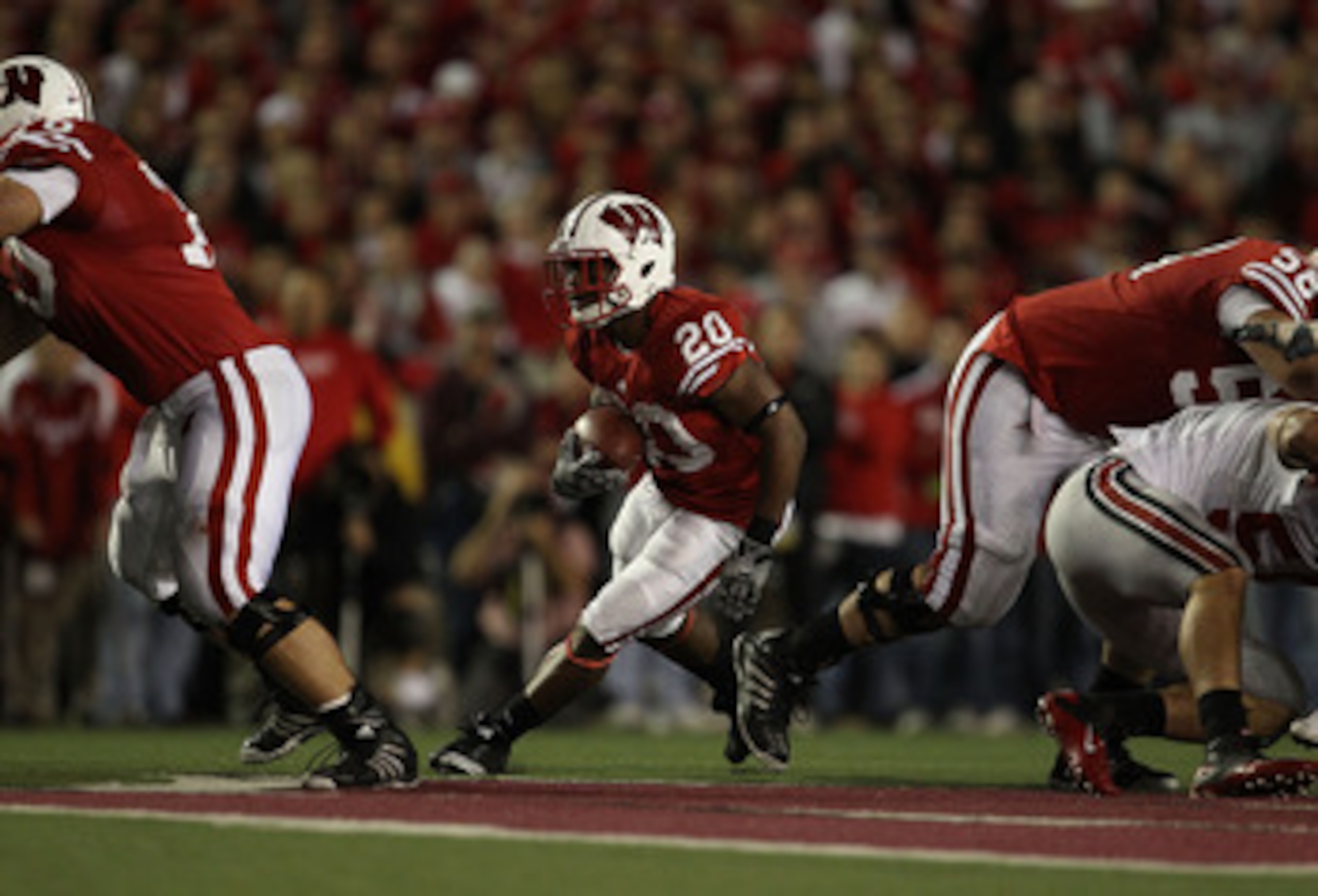 MADISON, WI - OCTOBER 16: James White #20 of the Wisconsin Badgers runs against the Ohio State Buckeyes at Camp Randall Stadium on October 16, 2010 in Madison, Wisconsin. Wisconsin defeated Ohio State 31-18. (Photo by Jonathan Daniel/Getty Images)