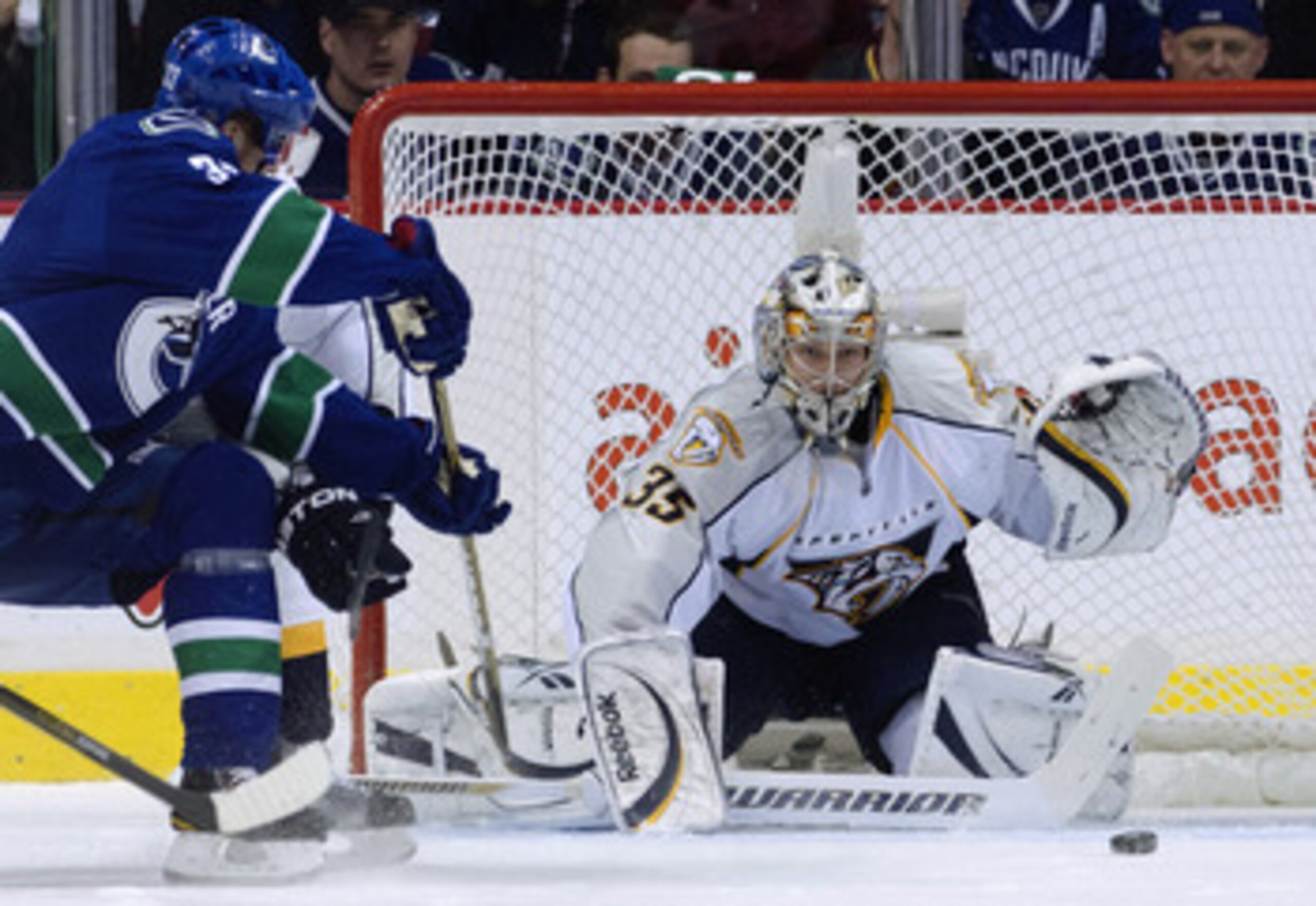 VANCOUVER, CANADA - APRIL 30: Henrik Sedin #33 of the Vancouver Canucks watches his puck slide wide past goalie Pekka Rinne #35 of the Nashville Predators during the first period in Game Two of the Western Conference Semifinals during the 2011 NHL Stanley