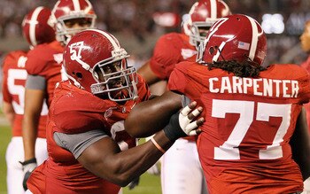 TUSCALOOSA, AL - OCTOBER 16:  Marcell Dareus #57 and James Carpenter #77 of the Alabama Crimson Tide against the Ole Miss Rebels at Bryant-Denny Stadium on October 16, 2010 in Tuscaloosa, Alabama.  (Photo by Kevin C. Cox/Getty Images)