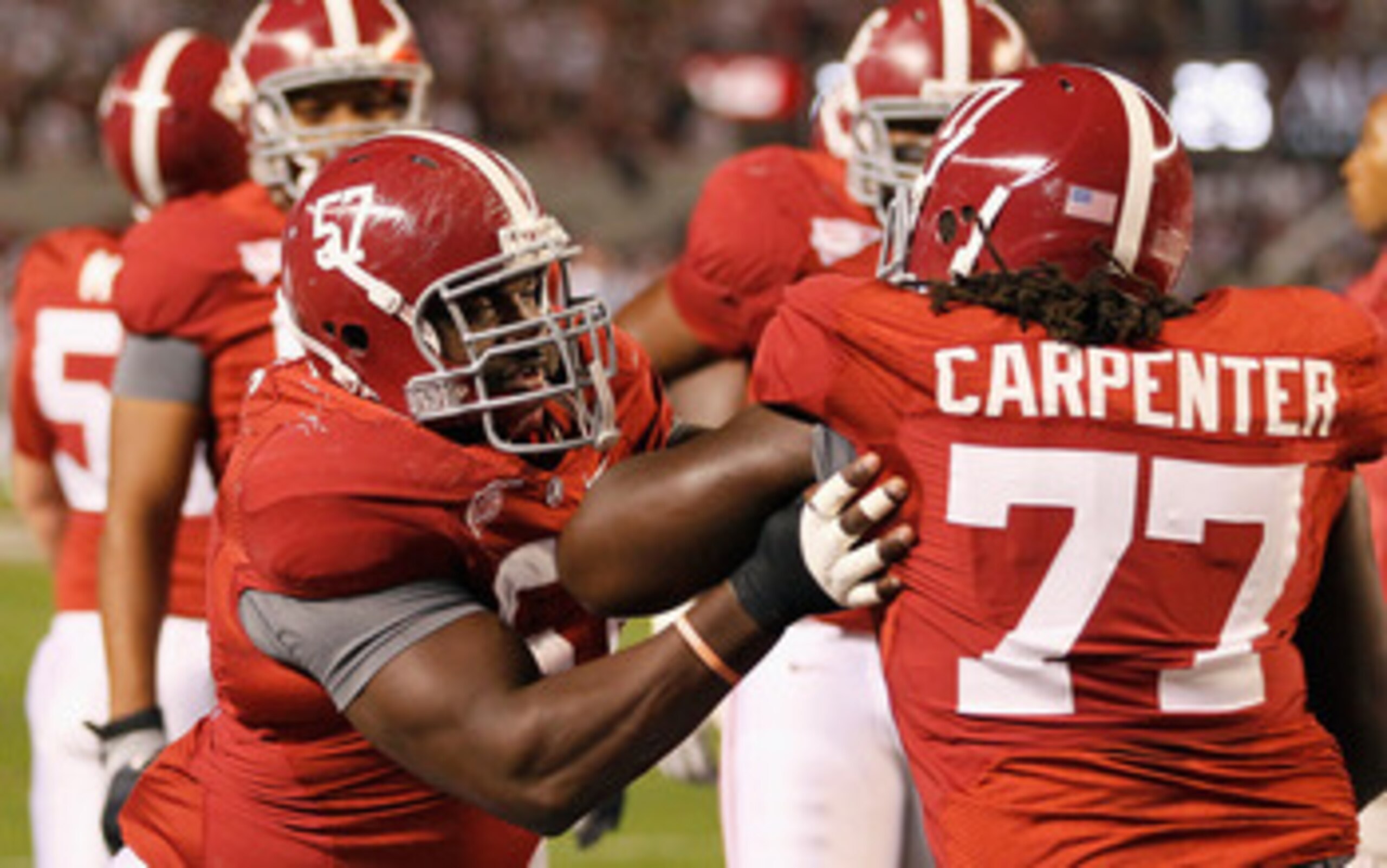 TUSCALOOSA, AL - OCTOBER 16:  Marcell Dareus #57 and James Carpenter #77 of the Alabama Crimson Tide against the Ole Miss Rebels at Bryant-Denny Stadium on October 16, 2010 in Tuscaloosa, Alabama.  (Photo by Kevin C. Cox/Getty Images)
