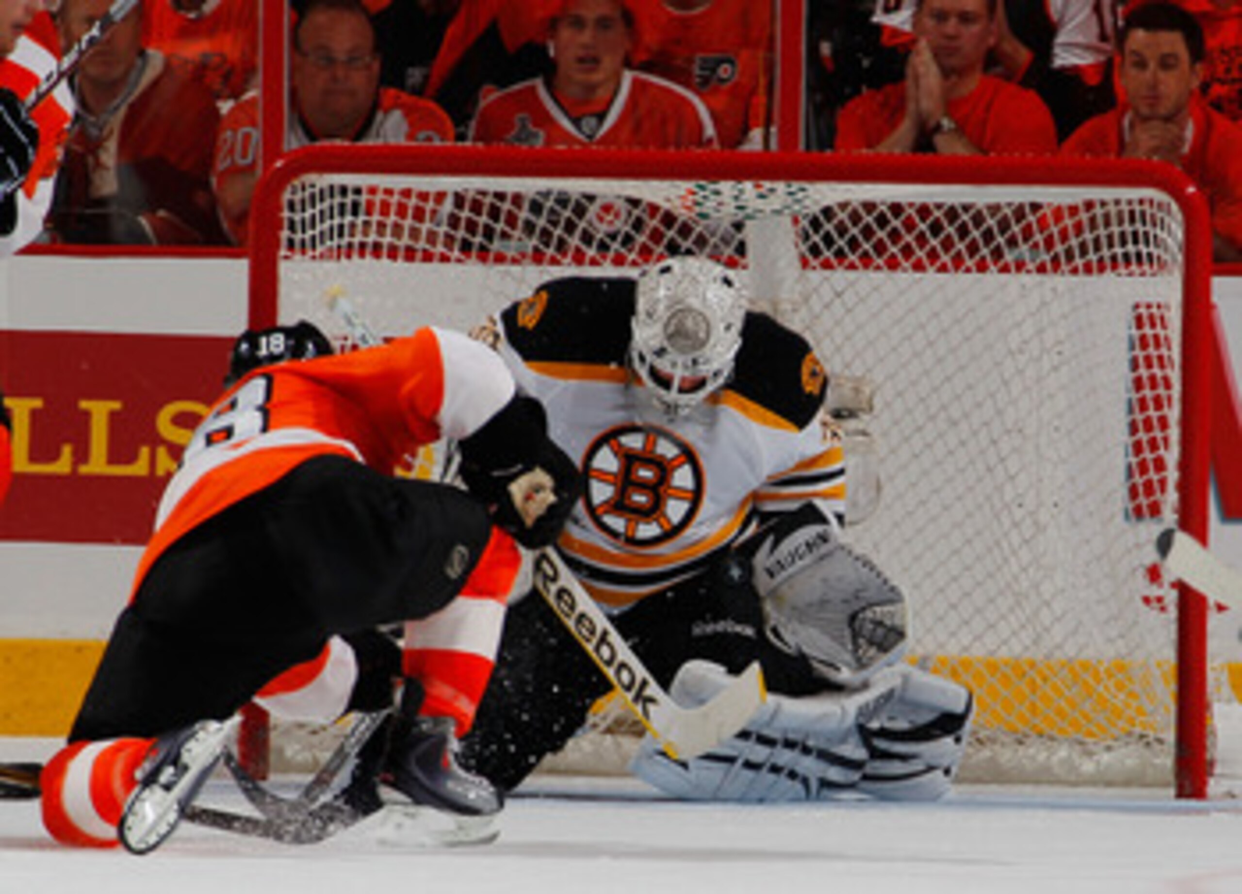 PHILADELPHIA, PA - MAY 02:  Goalie Tim Thomas #30 of the Boston Bruins stops a shot by Mike Richards #18 of the Philadelphia Flyers during the third period of Game Two of the Eastern Conference Semifinals during the 2011 NHL Stanley Cup Playoffs at Wells 