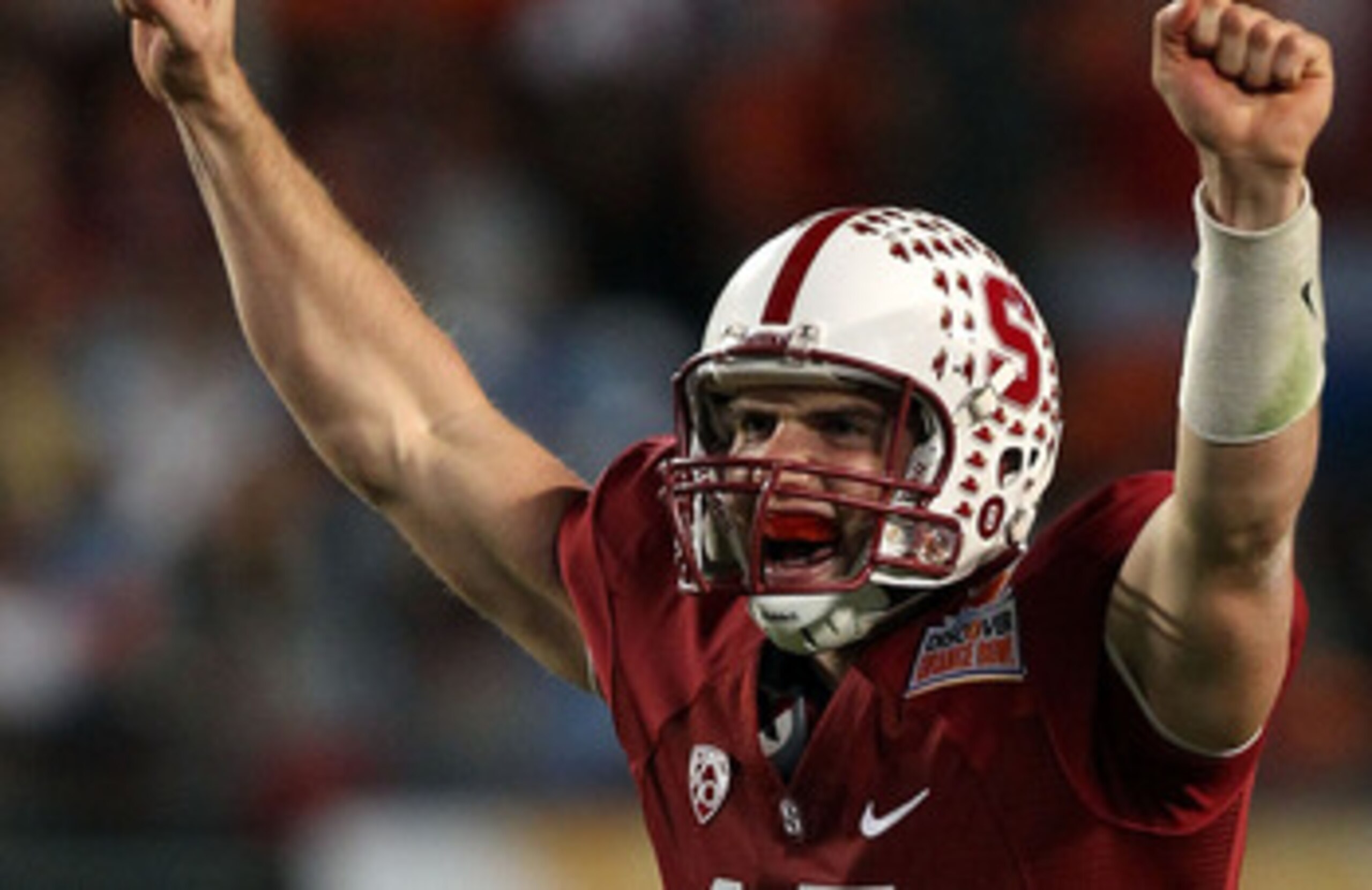 MIAMI, FL - JANUARY 03:  Andrew Luck #12 of the Stanford Cardinal celebrates after he threw a 38-yard touchdown pass in the fourth quarter against the Virginai Tech Hokies during the 2011 Discover Orange Bowl at Sun Life Stadium on January 3, 2011 in Miam