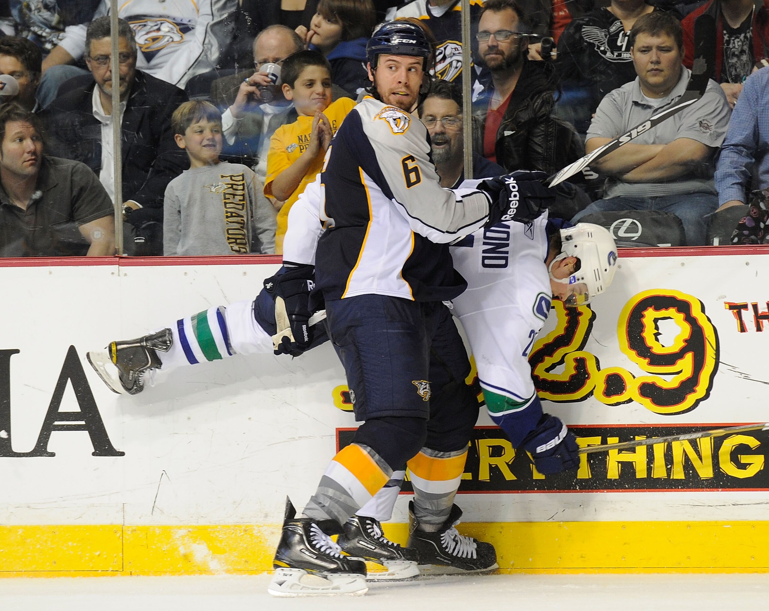 NASHVILLE, TN - FEBRUARY 17:  Mason Raymond #21 of the Vancouver Canucks is checked by Shea Weber #6 of the Nashville Predators on February 17, 2011 at the Bridgestone Arena in Nashville, Tennessee.  (Photo by Frederick Breedon/Getty Images)