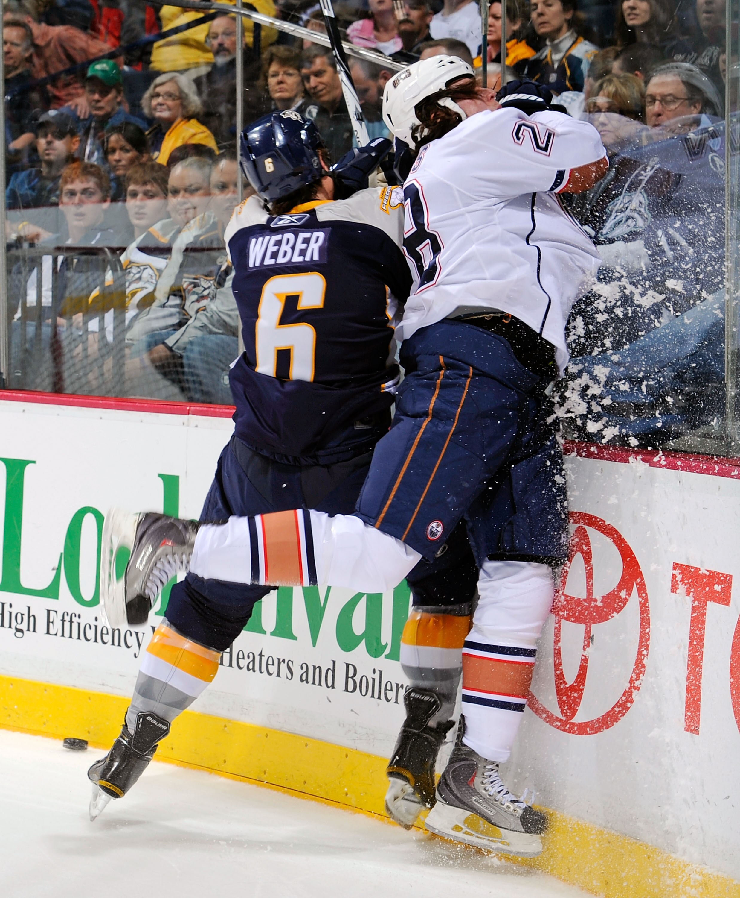 NASHVILLE, TN - MARCH 22:  Shea Weber #6 of the Nashville Predators checks Ryan Jones #28 of the Edmonton Oilers on March 22, 2011 at the Bridgestone Arena in Nashville, Tennessee.  (Photo by Frederick Breedon/Getty Images)