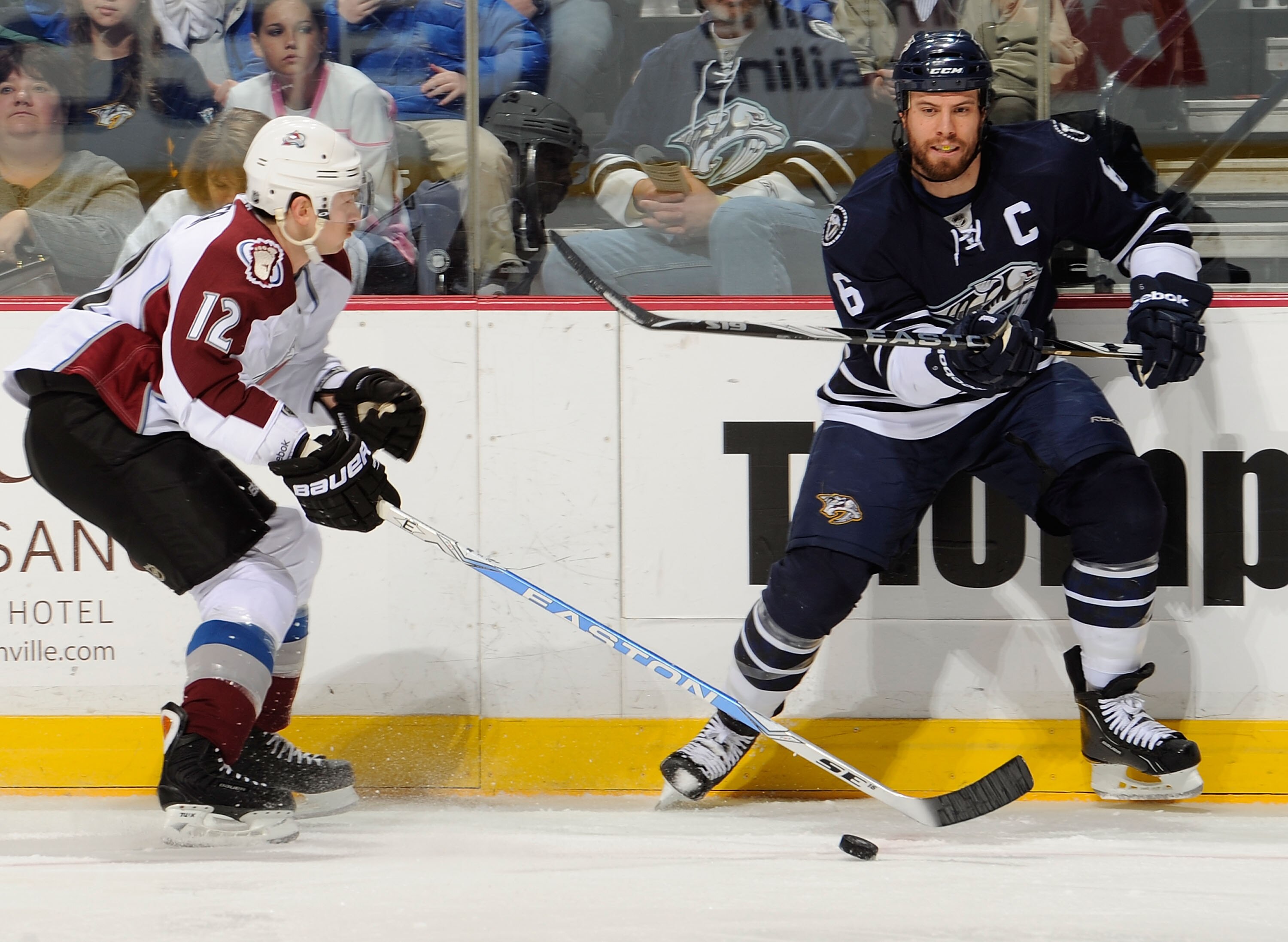 NASHVILLE, TN - MARCH 12:  Shea Weber #6 of the Nashville Predators skates against Kevin Porter #12 of the Colorado Avalanche on March 12, 2011 at the Bridgestone Arena in Nashville, Tennessee.  (Photo by Frederick Breedon/Getty Images)