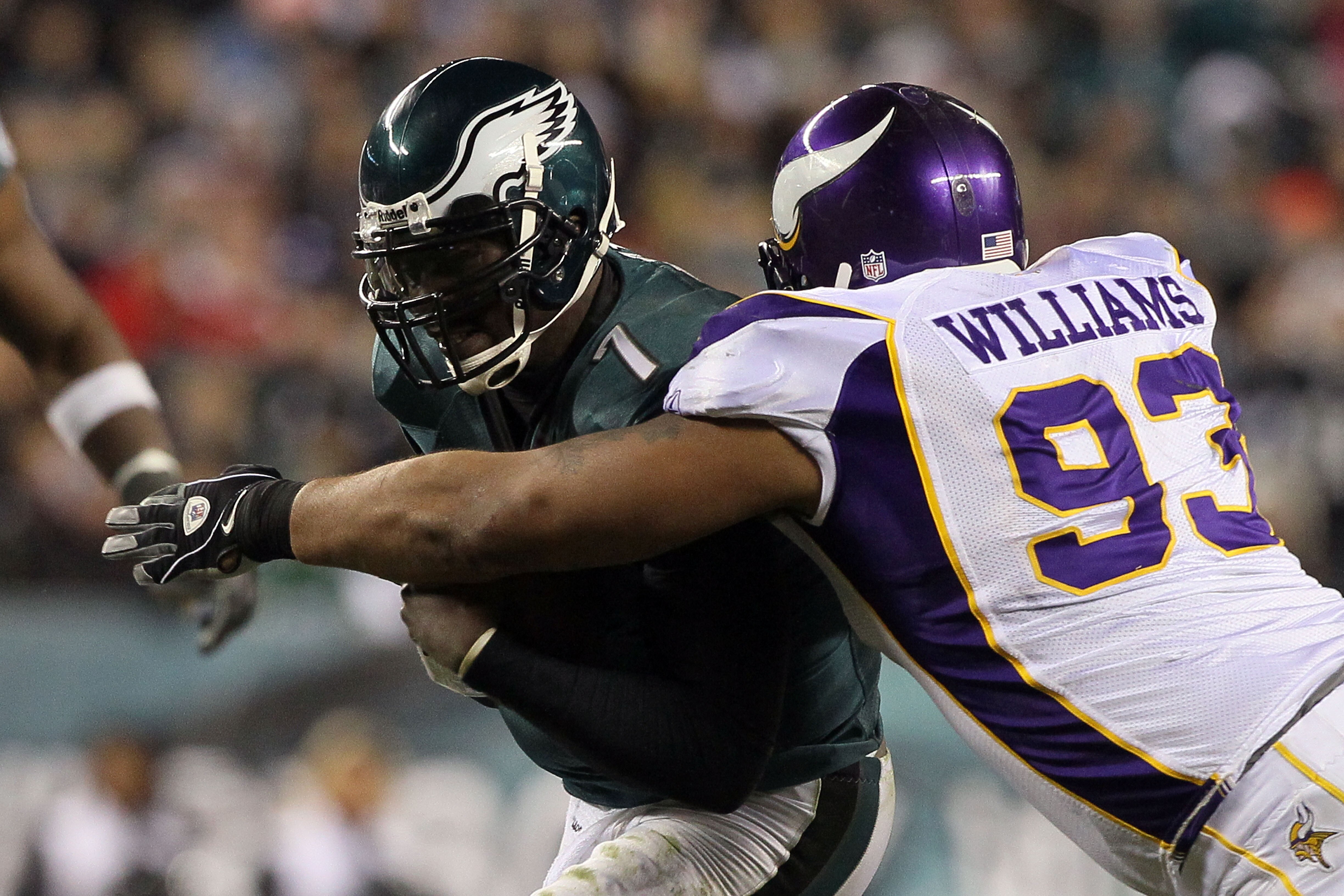 PHILADELPHIA, PA - DECEMBER 28:  Michael Vick #7 of the Philadelphia Eagles in action against Kevin Williams #93 of the Minnesota Vikings at Lincoln Financial Field on December 26, 2010 in Philadelphia, Pennsylvania.  (Photo by Jim McIsaac/Getty Images)