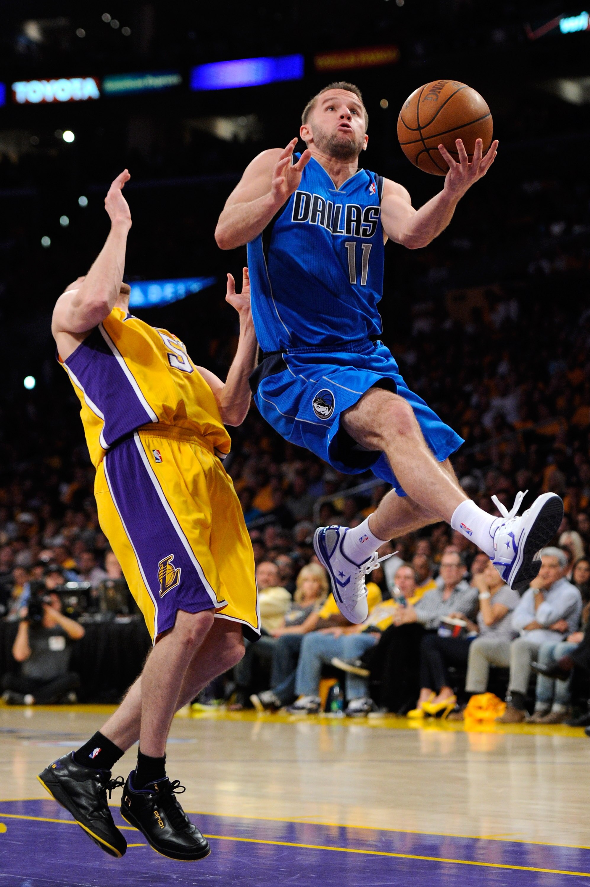 LOS ANGELES, CA - MAY 02:  Jose Juan Barea #11 of the Dallas Mavericks goes up for a shot alongside Steve Blake #5 of the Los Angeles Lakers in the fourth quarter in Game One of the Western Conference Semifinals in the 2011 NBA Playoffs at Staples Center