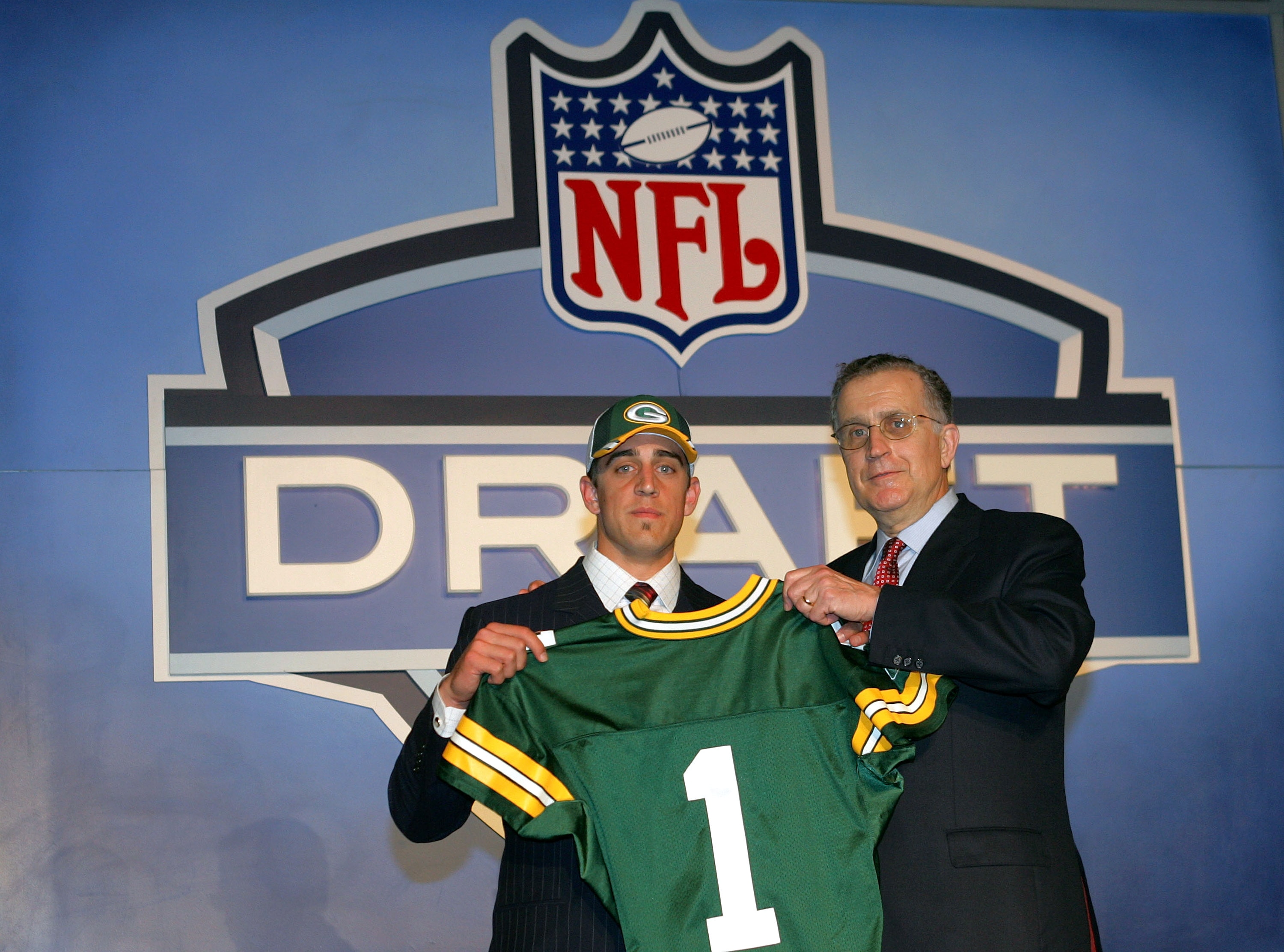 NEW YORK - APRIL 23:  Quarterback Aaron Rodgers (California) poses with NFL Commissioner Paul Tagliabue after Rodgers was drafted 24th overall by the Green Bay Packers during the 70th NFL Draft on April 23, 2005 at the Jacob K. Javits Convention Center in