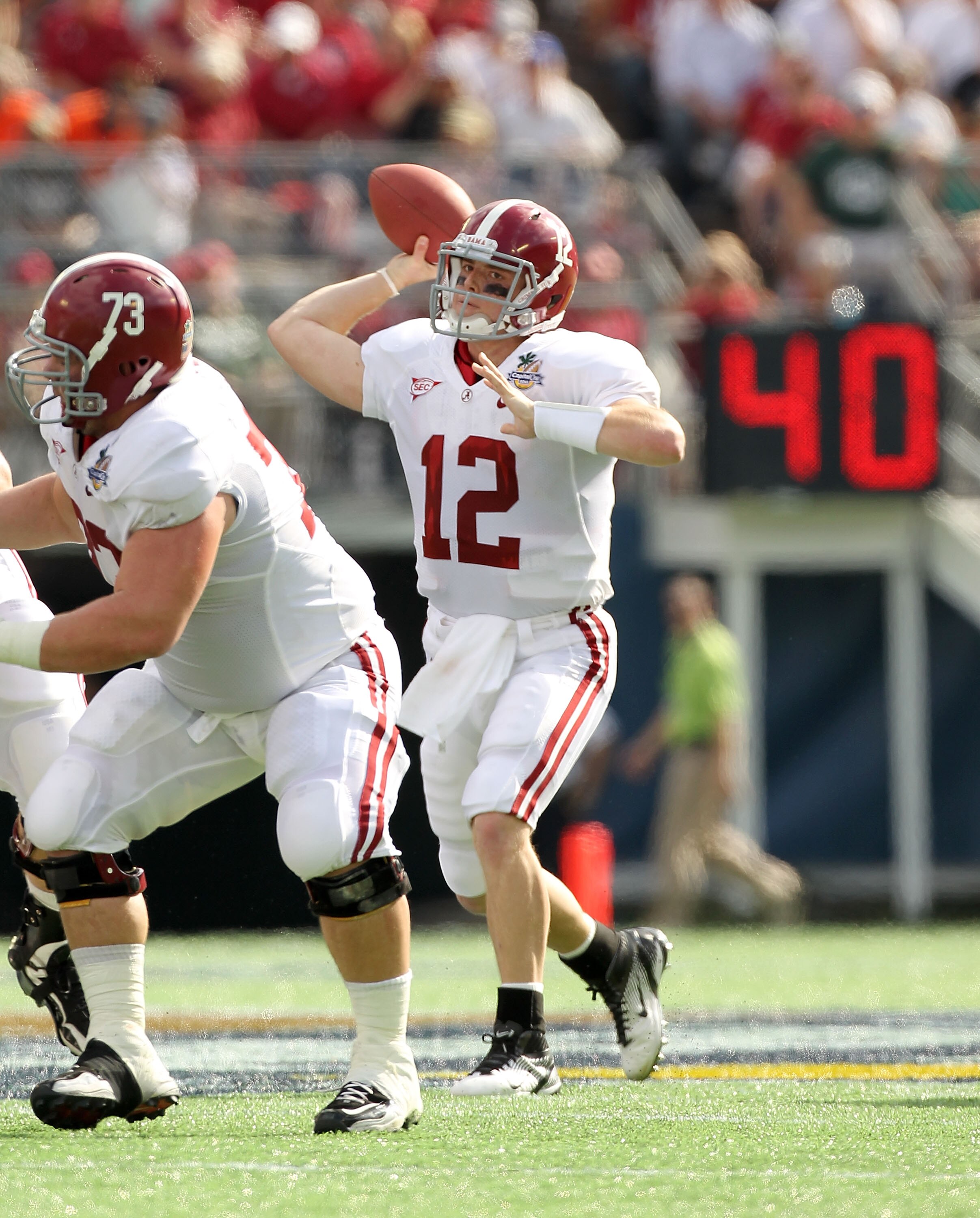 ORLANDO, FL - JANUARY 01:  Greg McElroy #12 of the Alabama Crimson Tide passes the ball during the Capitol One Bowl against the Michigan State Spartans at the Florida Citrus Bowl on January 1, 2011 in Orlando, Florida.  (Photo by Mike Ehrmann/Getty Images