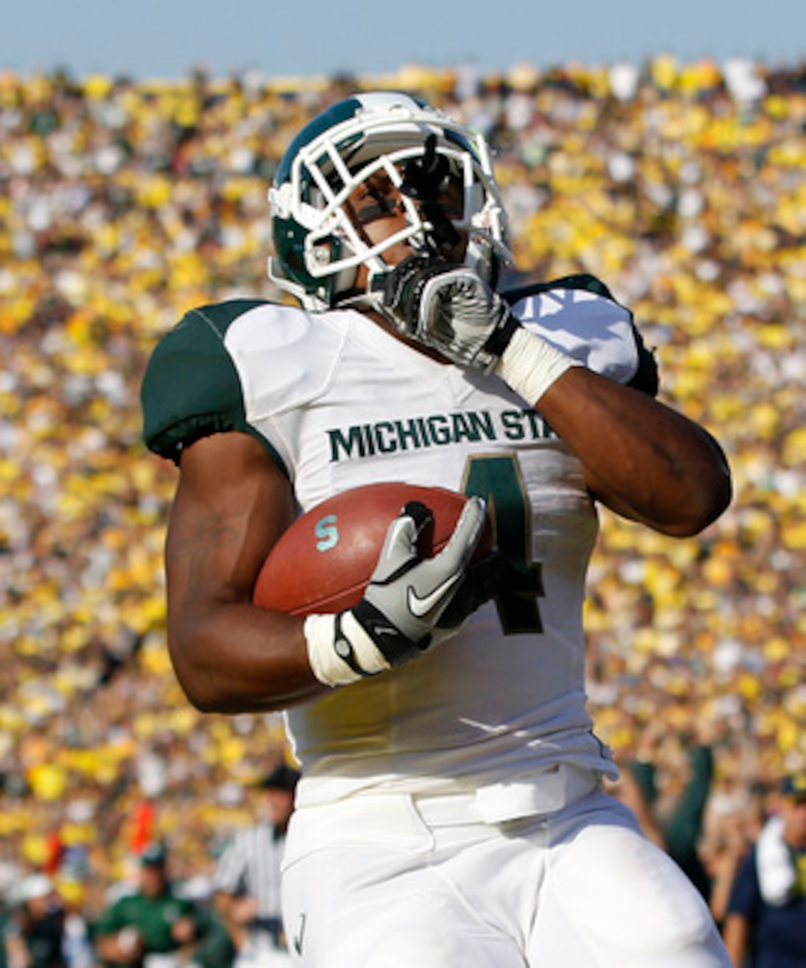 ANN ARBOR, MI - OCTOBER 09: Edwin Baker #4 of the Michigan State Spartans scores on a 61 yard touchdown in the second quarter during the game against the Michigan Wolverines during the game on October 9, 2010 at Michigan Stadium in Ann Arbor, Michigan. Th