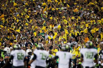 GLENDALE, AZ - JANUARY 10:  The Oregon Ducks fans cheer as the Ducks offense is on the field against the Auburn Tigers defense during the Tostitos BCS National Championship Game at University of Phoenix Stadium on January 10, 2011 in Glendale, Arizona.  (