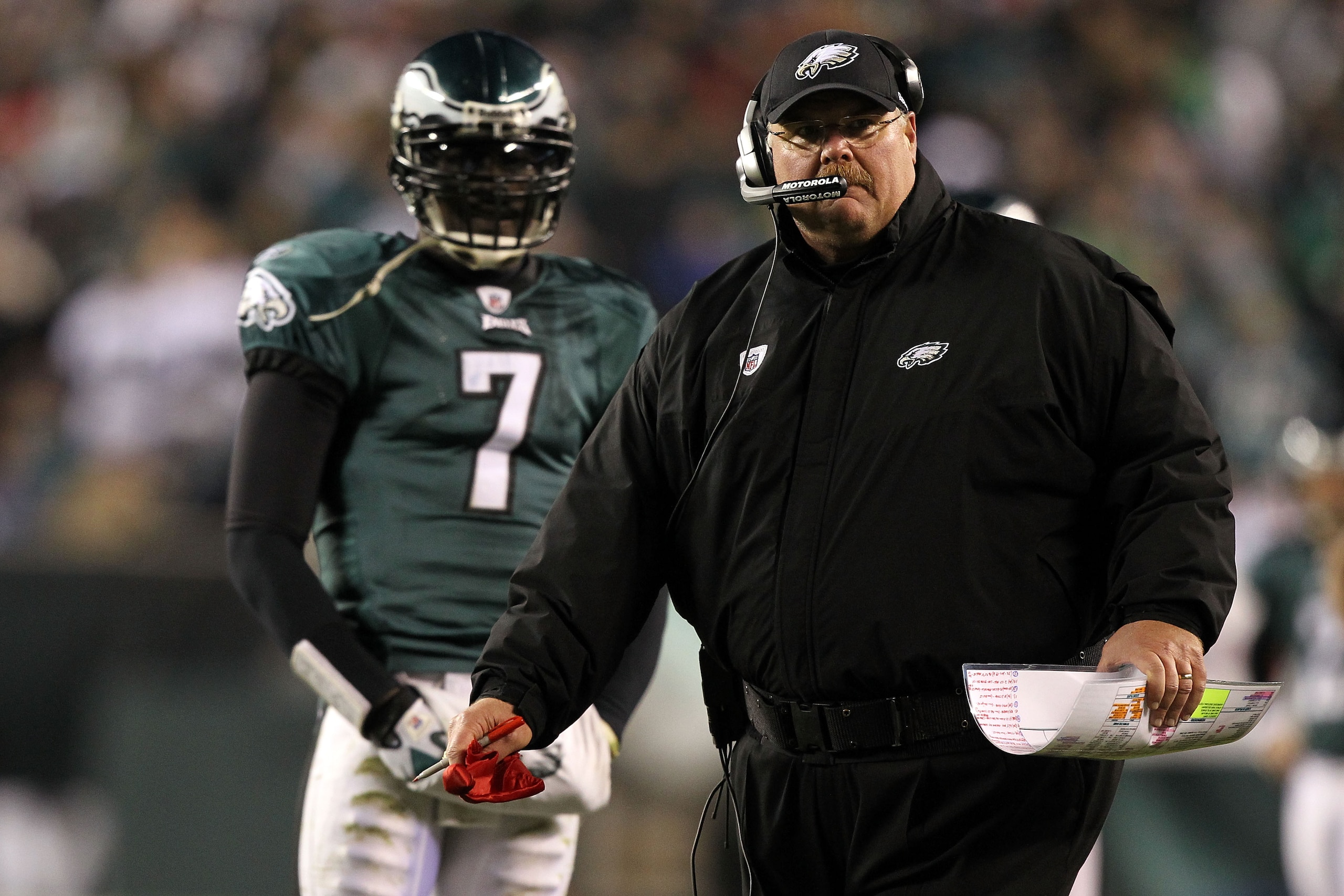 PHILADELPHIA, PA - DECEMBER 02:  Head coach Andy Reid of the Philadelphia Eagles throws the red challenge flag on a play involving Brent Celek #87 in the second half as Michael Vick #7 looks on against the Houston Texans at Lincoln Financial Field on Dece