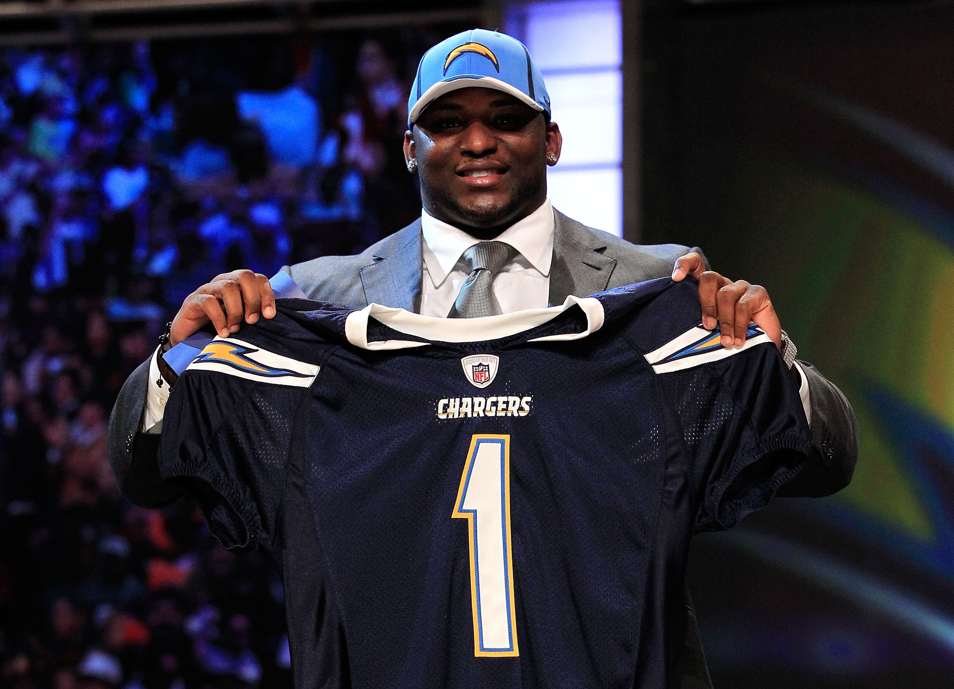 NEW YORK, NY - APRIL 28:  Corey Liuget, #18 overall pick by the San Diego Chargers, holds up a jersey on stage during the 2011 NFL Draft at Radio City Music Hall on April 28, 2011 in New York City.  (Photo by Chris Trotman/Getty Images)