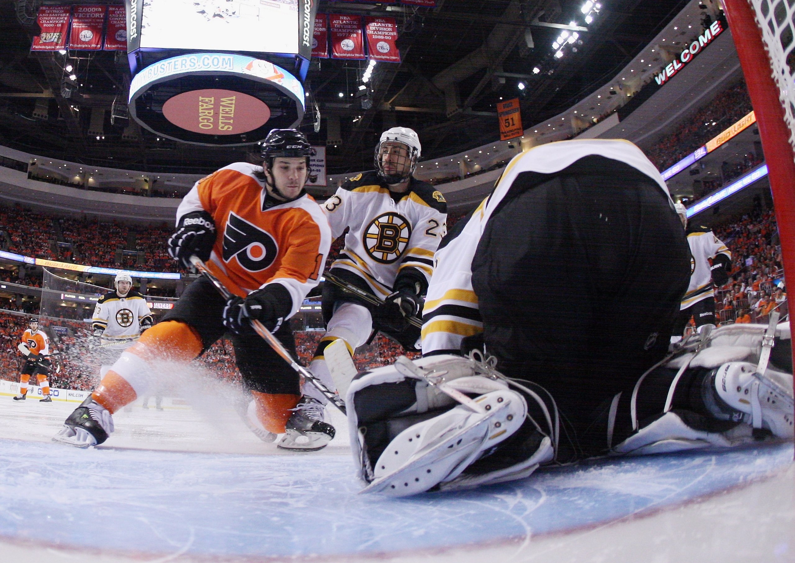 PHILADELPHIA, PA - APRIL 30: Tim Thomas #30 of the Boston Bruins stops Daniel Carcillo #13 of the Philadelphia Flyers in Game One of the Eastern Conference Semifinals during the 2011 NHL Stanley Cup Playoffs at the Wells Fargo Center on April 30, 2011 in