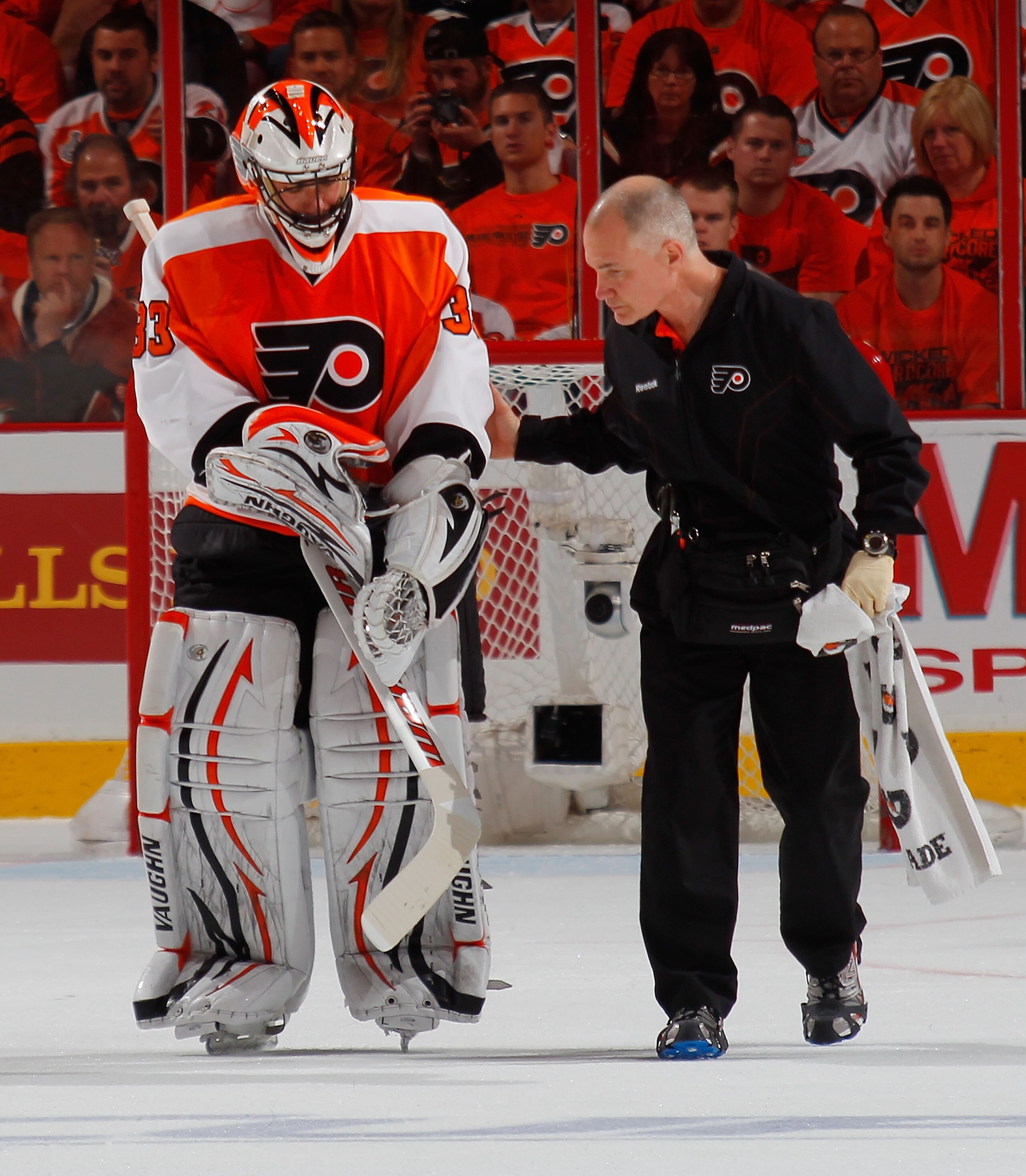PHILADELPHIA, PA - MAY 02:  Goalie Brian Boucher #33 of the Philadelphia Flyers is assisted off the ice after being injured during the second period of Game Two of the Eastern Conference Semifinals during the 2011 NHL Stanley Cup Playoffs against the Bost