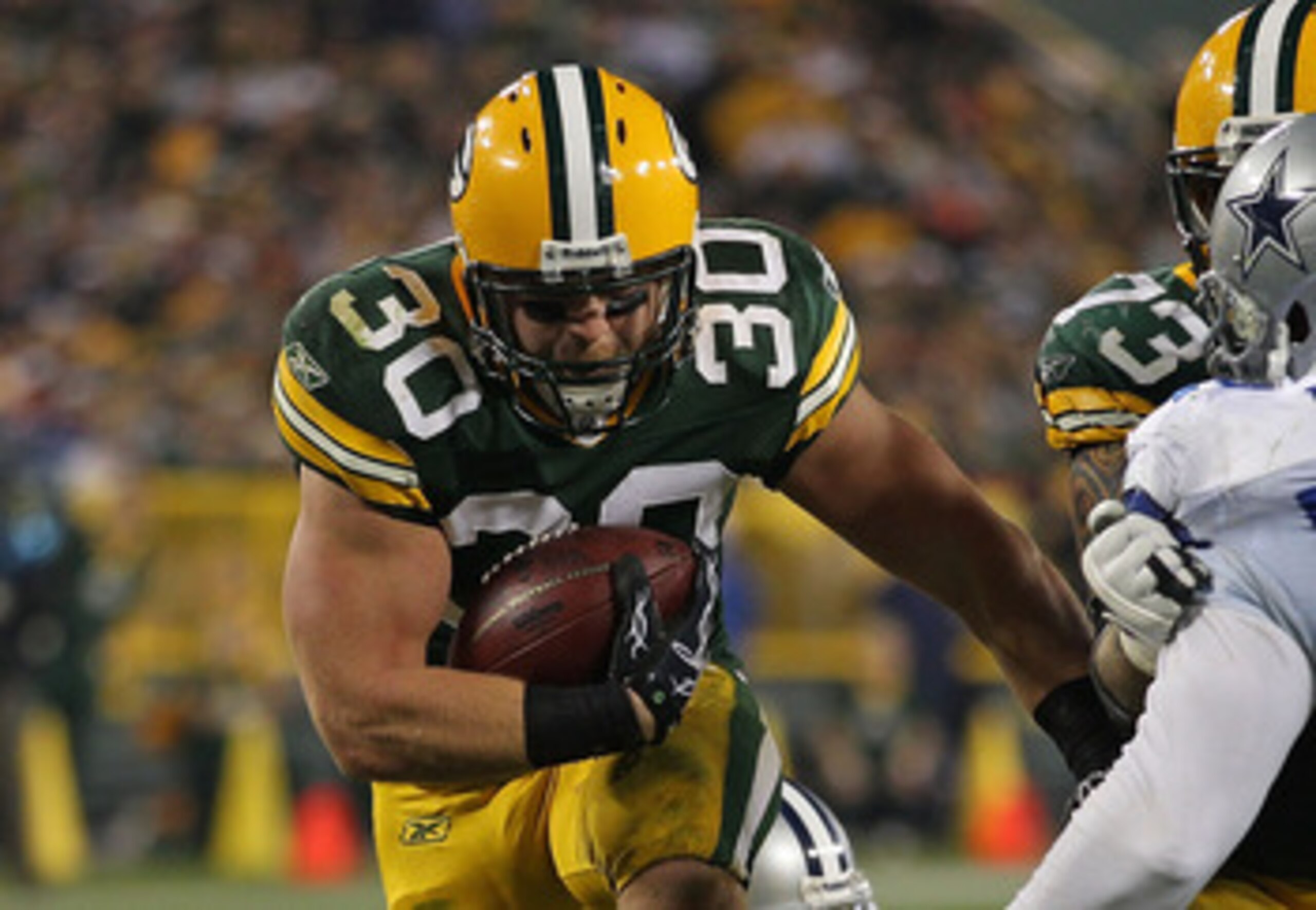 GREEN BAY, WI - NOVEMBER 07: John Kuhn #30 of the Green Bay Packers runs against the Dallas Cowboys at Lambeau Field on November 7, 2010 in Green Bay, Wisconsin. (Photo by Jonathan Daniel/Getty Images)