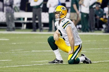 ATLANTA, GA - JANUARY 15:  Kicker Mason Crosby #2 of the Green Bay Packers reacts after Eric Weems #14 of the Atlanta Falcons scored a 10-yard kickoff return for a touchdown in the seocnd quarter during their 2011 NFC divisional playoff game at Georgia Do
