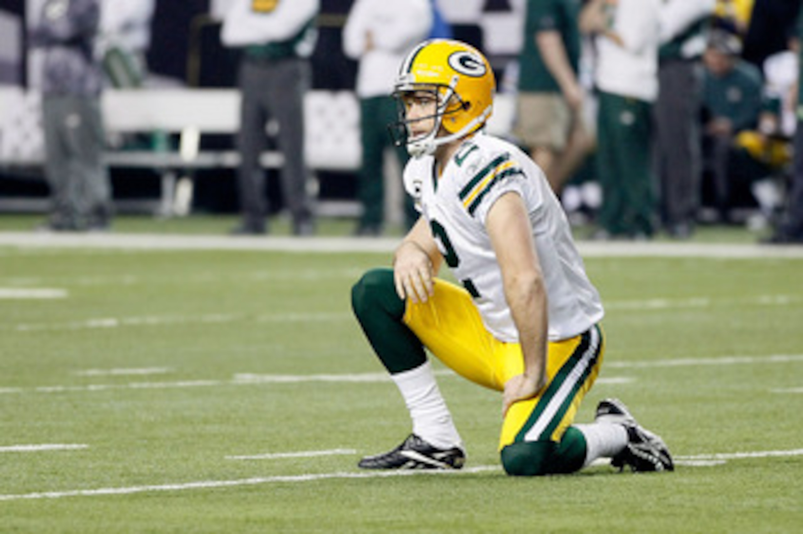 ATLANTA, GA - JANUARY 15:  Kicker Mason Crosby #2 of the Green Bay Packers reacts after Eric Weems #14 of the Atlanta Falcons scored a 10-yard kickoff return for a touchdown in the seocnd quarter during their 2011 NFC divisional playoff game at Georgia Do