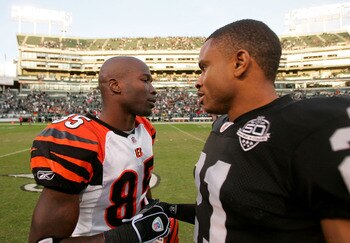 OAKLAND, CA - NOVEMBER 22:  Chad Ochocinco #85 of the Cincinnati Bengals is consoled by Nnamdi Asomugha #21 of the Oakland Raiders after the Raiders beat the Bengals at Oakland-Alameda County Coliseum on November 22, 2009 in Oakland, California.  (Photo b