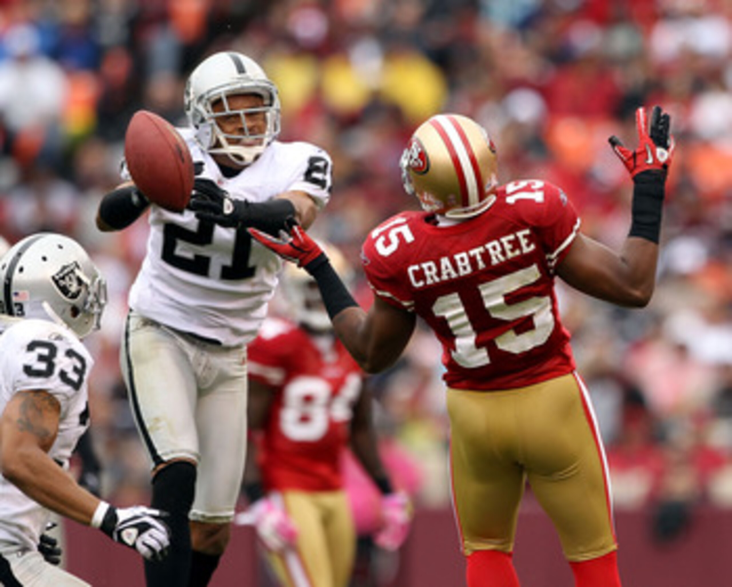 SAN FRANCISCO - OCTOBER 17:  Nnamdi Asomugha  #21 of the Oakland Raiders breaks up a pass intended for Michael Crabtree #15 of the San Francisco 49ers at Candlestick Park on October 17, 2010 in San Francisco, California.  (Photo by Ezra Shaw/Getty Images)