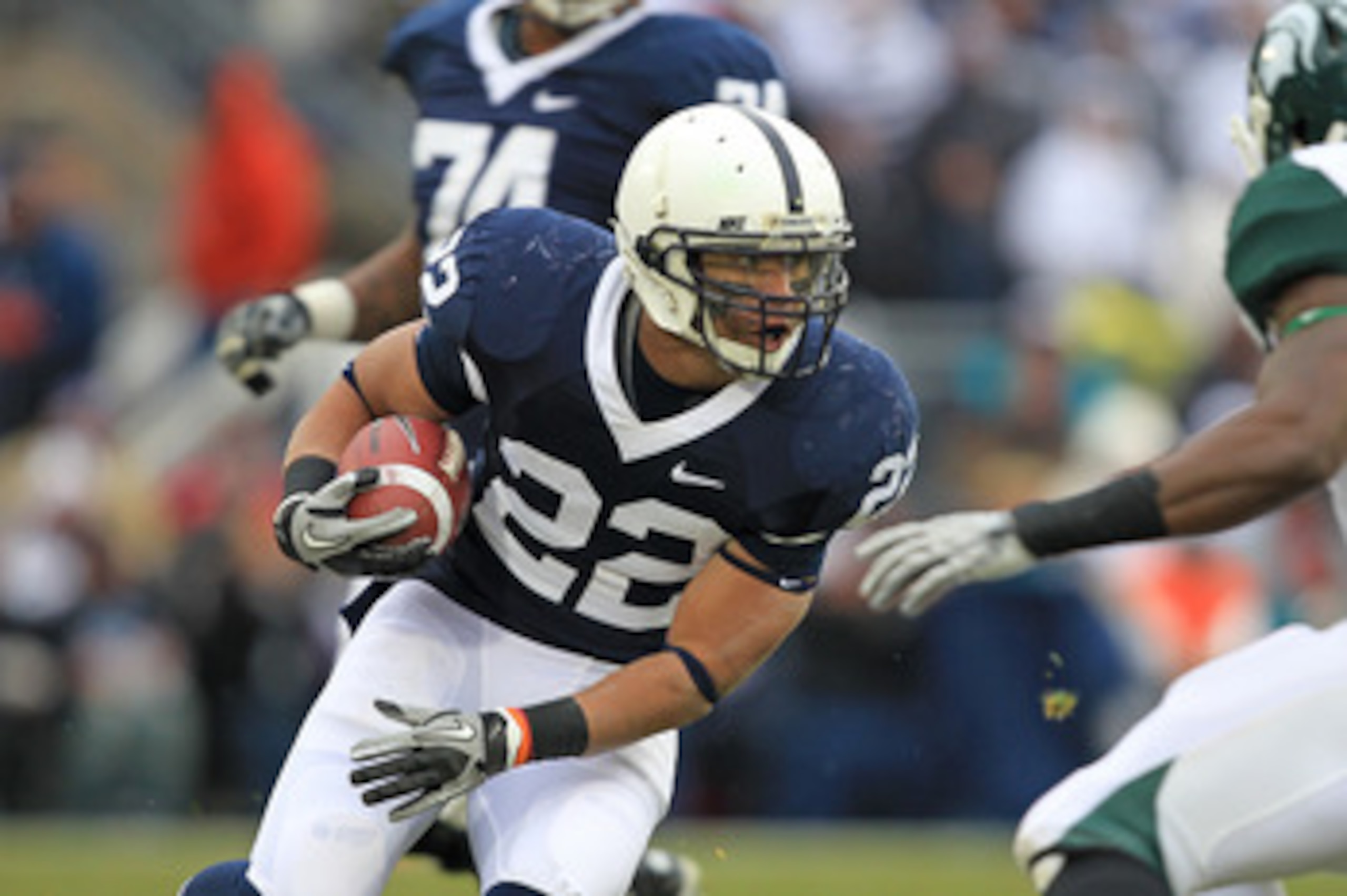 STATE COLLEGE, PA - NOVEMBER 27: Running back Evan Royster #22 of the Penn State Nittany Lions carries the ball during a game against the Michigan State Spartans on November 27, 2010 at Beaver Stadium in State College, Pennsylvania. The Spartans won 28-22 STATE COLLEGE, PA - NOVEMBER 27: Running back Evan Royster #22 of the Penn State Nittany Lions carries the ball during a game against the Michigan State Spartans on November 27, 2010 at Beaver Stadium in State College, Pennsylvania. The Spartans won 28-22
