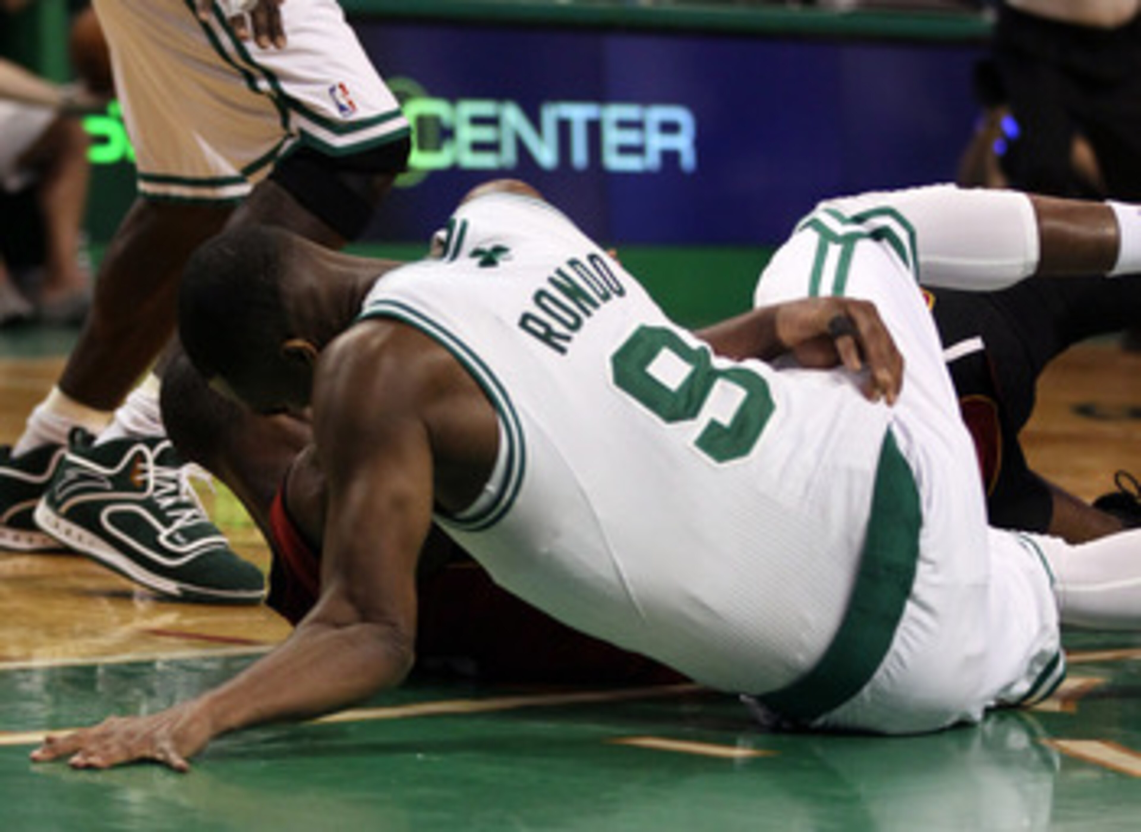 BOSTON, MA - MAY 07: Rajon Rondo #9 of the Boston Celtics injures his arm as he lands on the court after a scramble with Dwyane Wade #3 of the Miami Heat in Game Three of the Eastern Conference Semifinals in the 2011 NBA Playoffs on May 7, 2011 at the TD BOSTON, MA - MAY 07: Rajon Rondo #9 of the Boston Celtics injures his arm as he lands on the court after a scramble with Dwyane Wade #3 of the Miami Heat in Game Three of the Eastern Conference Semifinals in the 2011 NBA Playoffs on May 7, 2011 at the TD