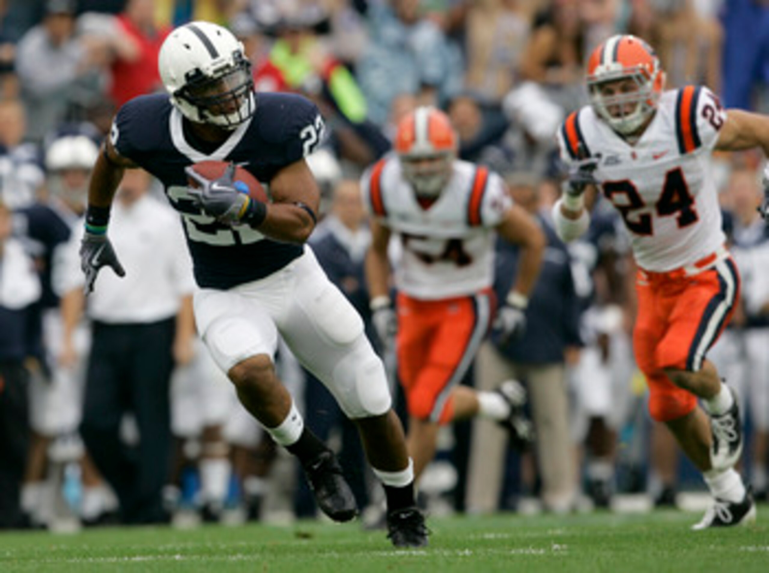 STATE COLLEGE, PA - SEPTEMBER 12: Running back Evan Royster #22 of the Penn State Nittany Lions runs for a touchdown followed by Mikhail Marinovich (54) and Max Suter #24 of the Syracuse Orangemen during the first half at Beaver Stadium September 12, 20 STATE COLLEGE, PA - SEPTEMBER 12: Running back Evan Royster #22 of the Penn State Nittany Lions runs for a touchdown followed by Mikhail Marinovich (54) and Max Suter #24 of the Syracuse Orangemen during the first half at Beaver Stadium September 12, 20