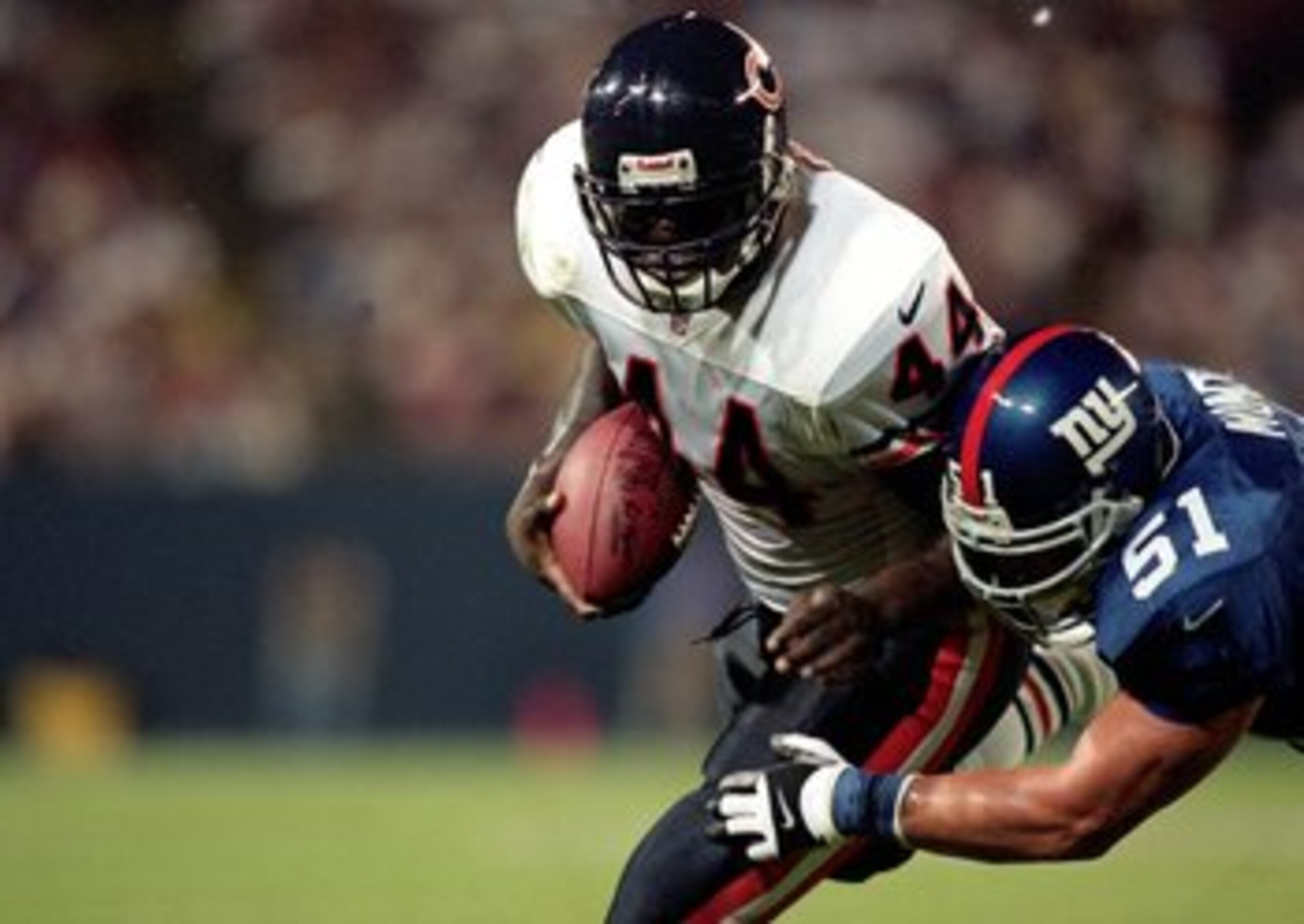 5 Aug 2000: Curtis Enis #44 of the Chicago Bears carries the ball as he is tackled by Pete Monty #51of the New York Giants at Giants Stadium in East Rutherford, New Jersey. The Bears defeated the Giants 20-8.Mandatory Credit: Jamie Squire /Allsport 5 Aug 2000: Curtis Enis #44 of the Chicago Bears carries the ball as he is tackled by Pete Monty #51of the New York Giants at Giants Stadium in East Rutherford, New Jersey. The Bears defeated the Giants 20-8.Mandatory Credit: Jamie Squire /Allsport
