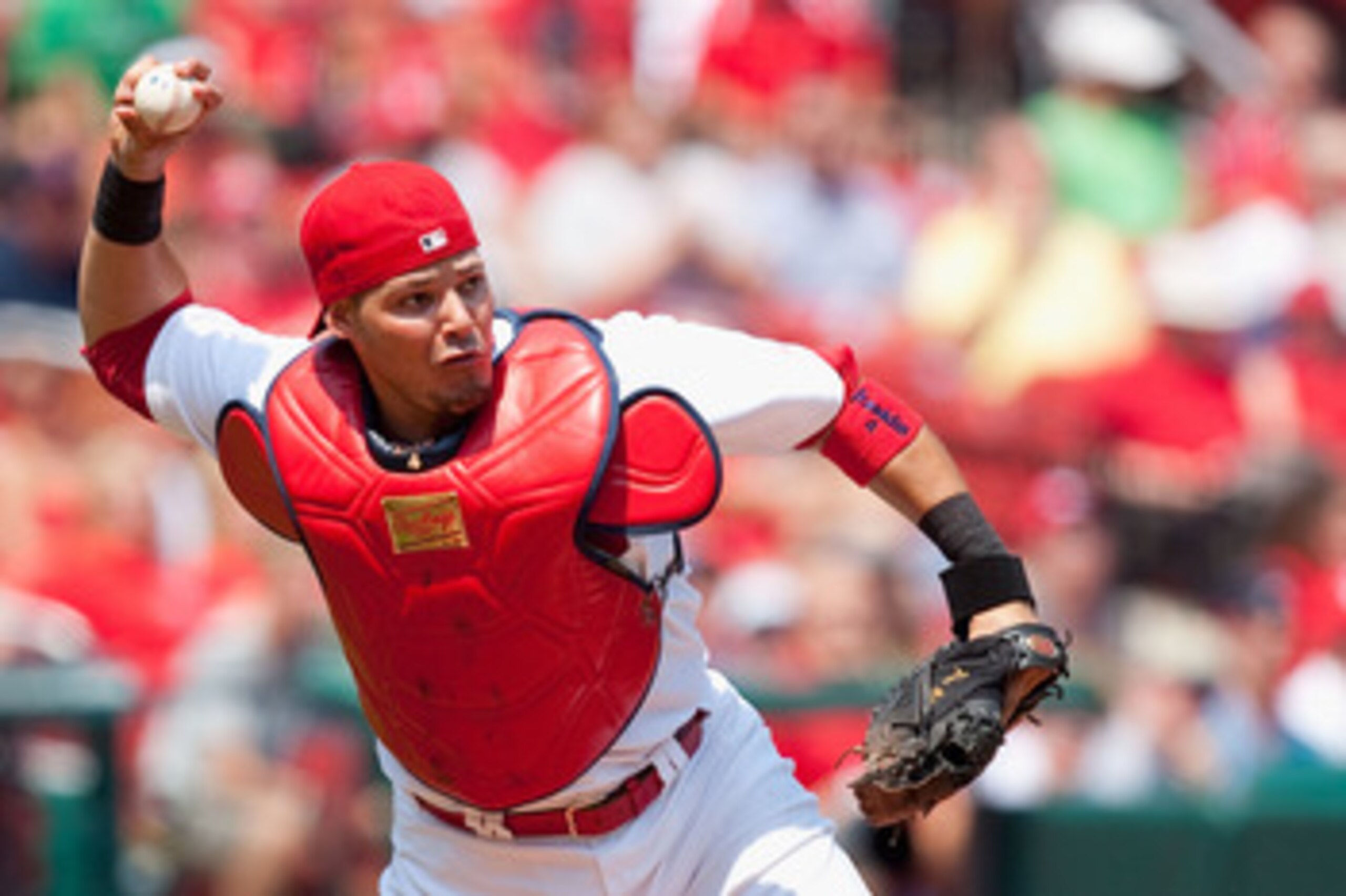 ST. LOUIS - AUGUST 18: Yadier Molina #4 of the St. Louis Cardinals throws to first base against the Milwaukee Brewers  at Busch Stadium on August 18, 2010 in St. Louis, Missouri.  The Brewers beat the Cardinals 3-2.  (Photo by Dilip Vishwanat/Getty Images