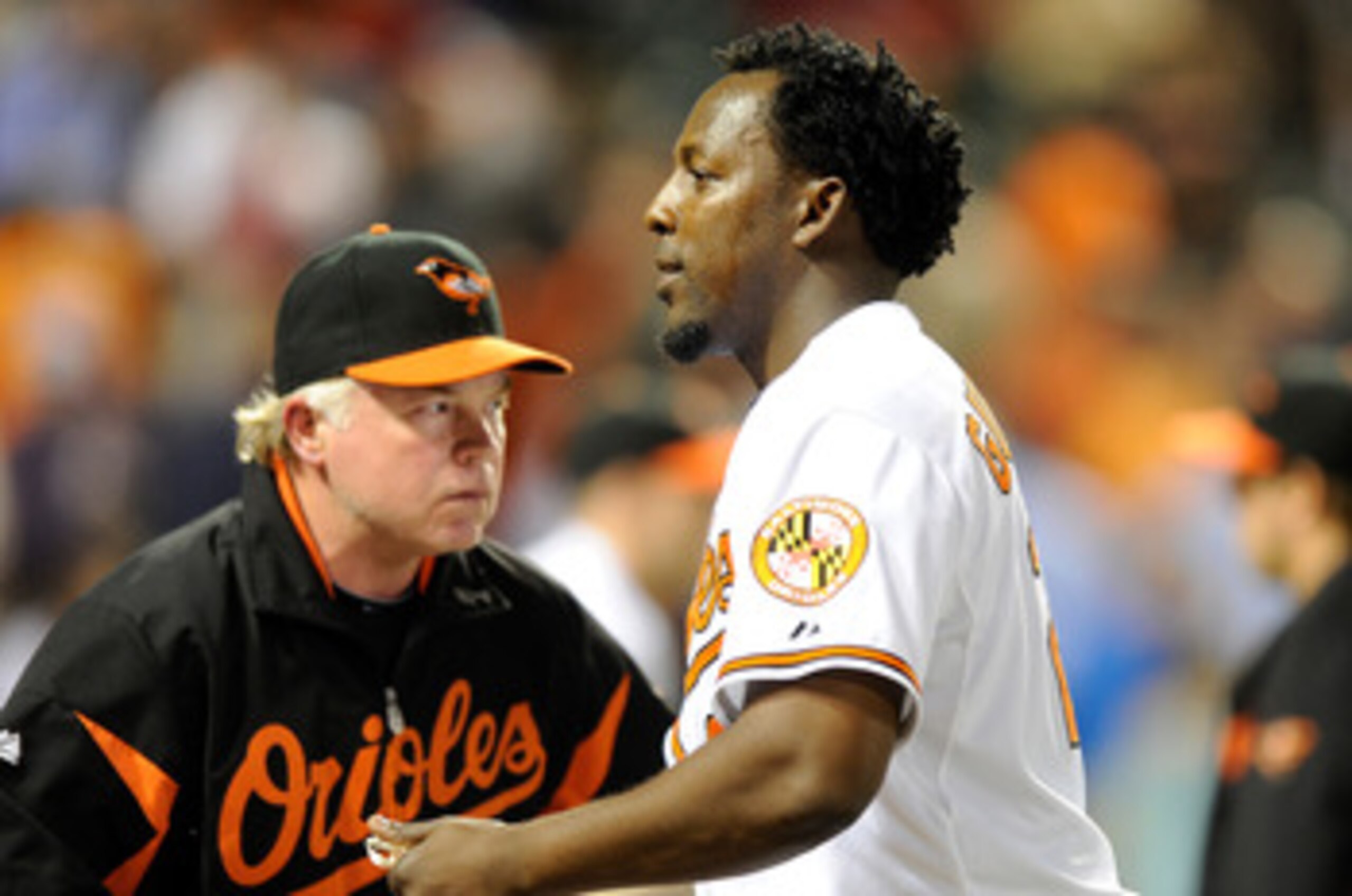 BALTIMORE, MD - APRIL 27: Vladimir Guerrero #27 of the Baltimore Orioles is congratulated by manager Buck Showalter #26 after a 5-4 victory against the Boston Red Sox at Oriole Park at Camden Yards on April 27, 2011 in Baltimore, Maryland. (Photo by Greg BALTIMORE, MD - APRIL 27: Vladimir Guerrero #27 of the Baltimore Orioles is congratulated by manager Buck Showalter #26 after a 5-4 victory against the Boston Red Sox at Oriole Park at Camden Yards on April 27, 2011 in Baltimore, Maryland. (Photo by Greg