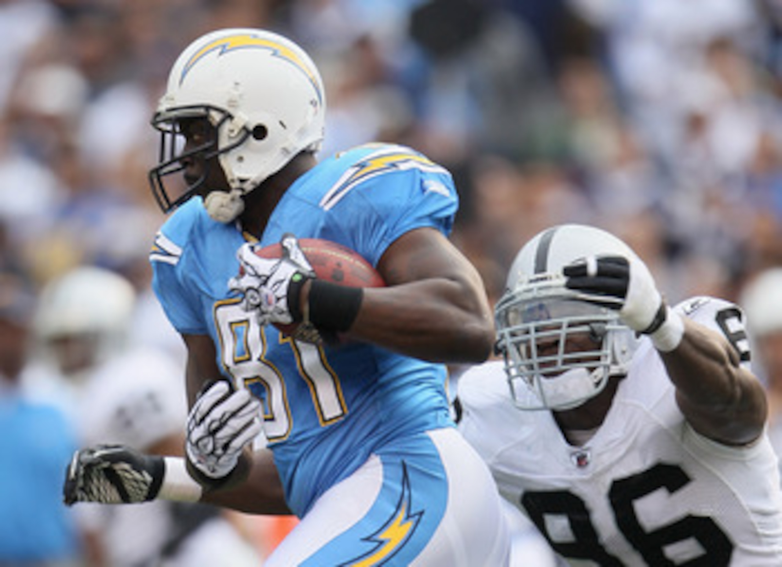 SAN DIEGO - DECEMBER 05: Randy McMichael #81 of the San Diego Chargers is pursued by Kamerion Wimbley #96 of the Oakland Raiders at Qualcomm Stadium on December 5, 2010 in San Diego, California. The Raiders defeated the Chargers 28-13. (Photo by Jeff Gr SAN DIEGO - DECEMBER 05: Randy McMichael #81 of the San Diego Chargers is pursued by Kamerion Wimbley #96 of the Oakland Raiders at Qualcomm Stadium on December 5, 2010 in San Diego, California. The Raiders defeated the Chargers 28-13. (Photo by Jeff Gr