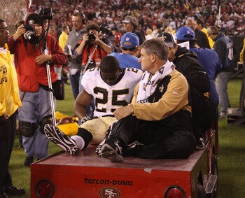 SAN FRANCISCO - SEPTEMBER 20:  Reggie Bush #25 of the New Orleans Saints leaves the field after being injured during their game against the San Francisco 49ers at Candlestick Park on September 20, 2010 in San Francisco, California.  (Photo by Ezra Shaw/Ge