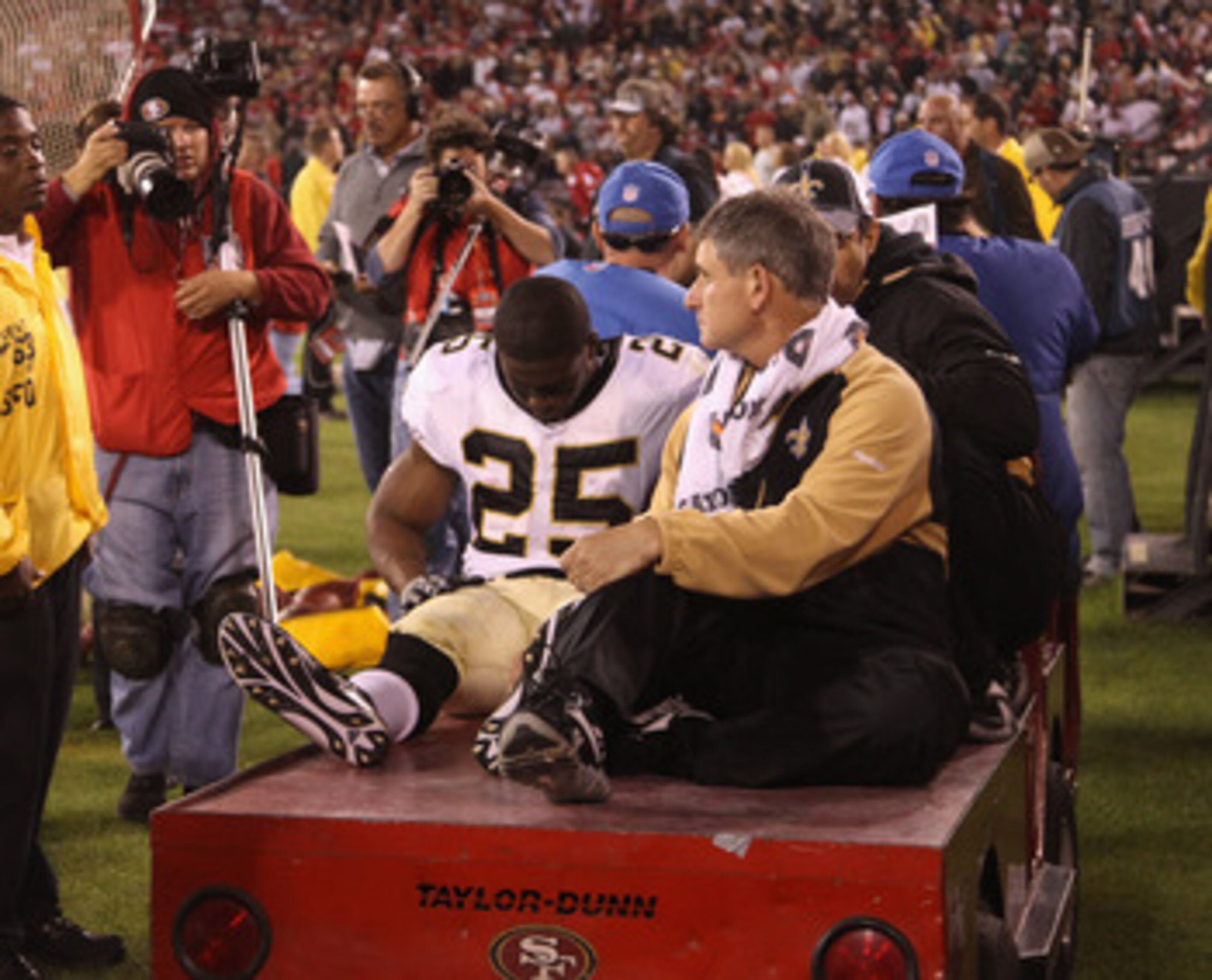 SAN FRANCISCO - SEPTEMBER 20:  Reggie Bush #25 of the New Orleans Saints leaves the field after being injured during their game against the San Francisco 49ers at Candlestick Park on September 20, 2010 in San Francisco, California.  (Photo by Ezra Shaw/Ge